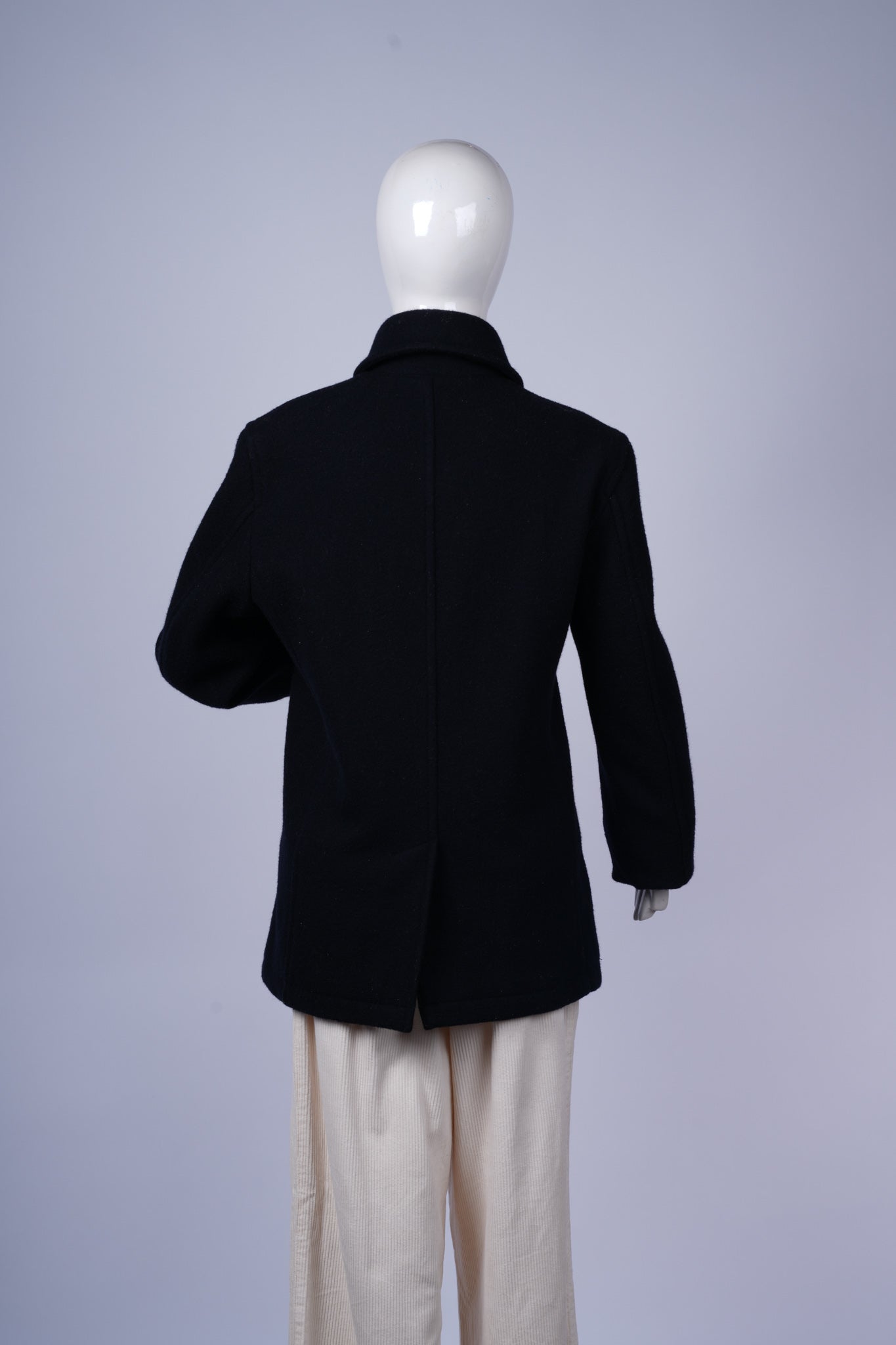 Elegant and versatile navy pea coat perfect for cold-weather layering.