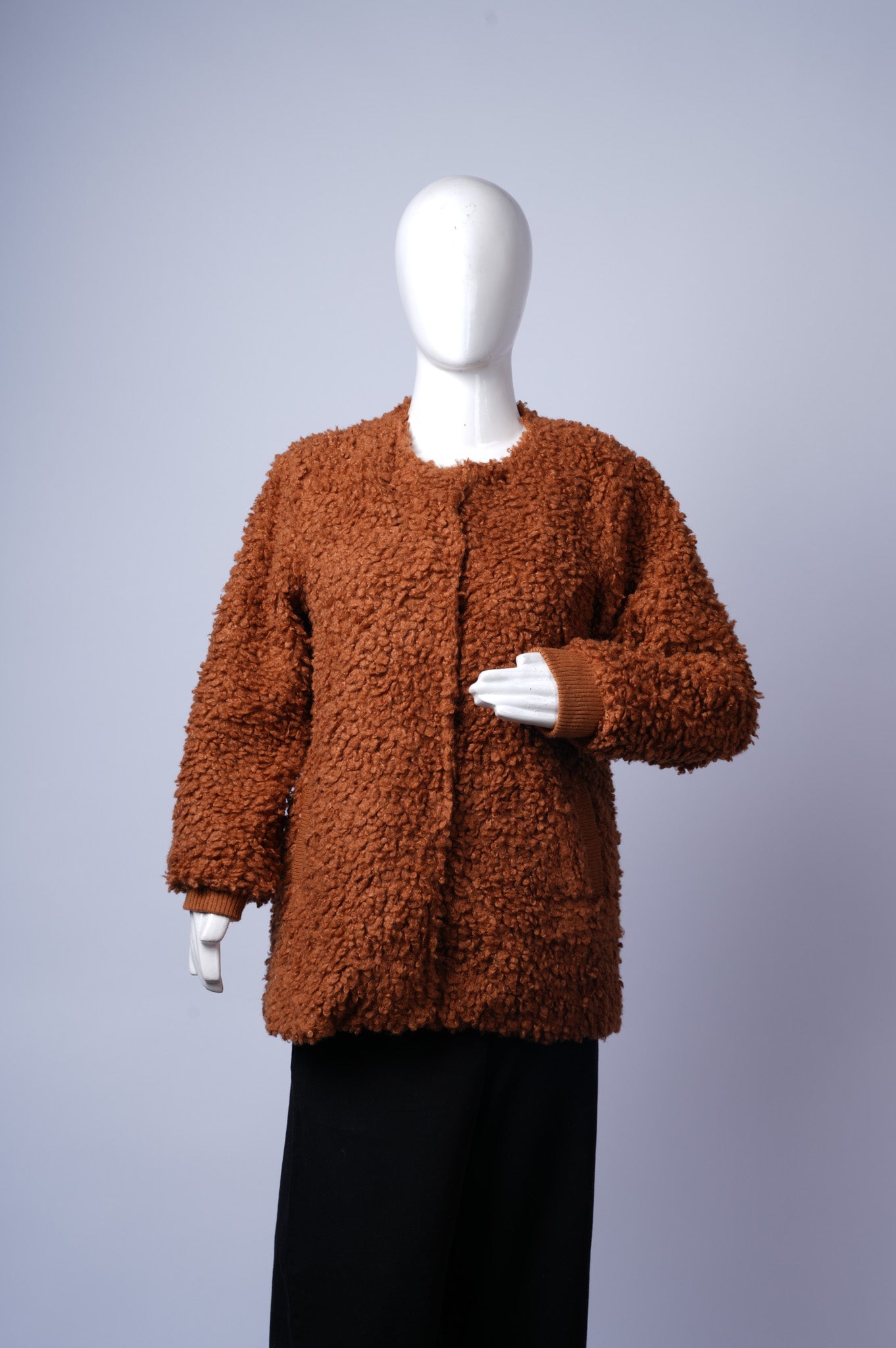 women's textured Sherpa Bouclé coat ideal for warm winter layering.