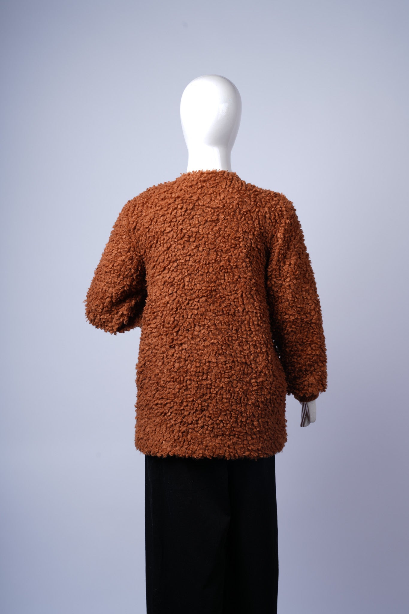 Stylish Sherpa Bouclé coat perfect for casual or dressy cold-weather outfits