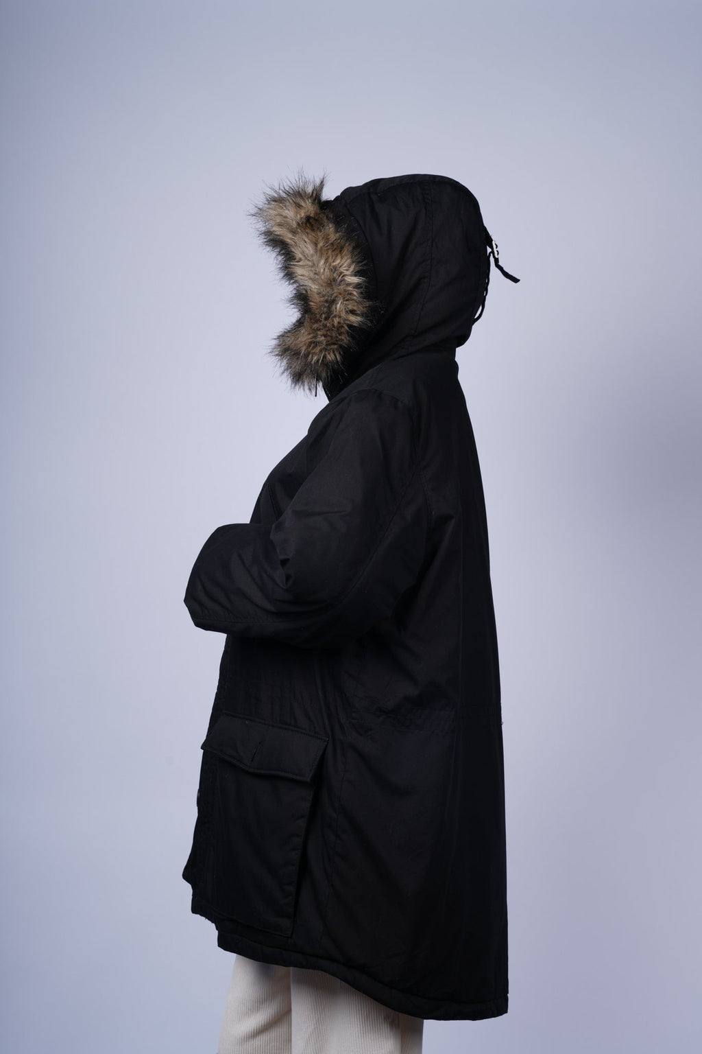 Stylish winter parka featuring cozy faux fur hood and functional pockets.