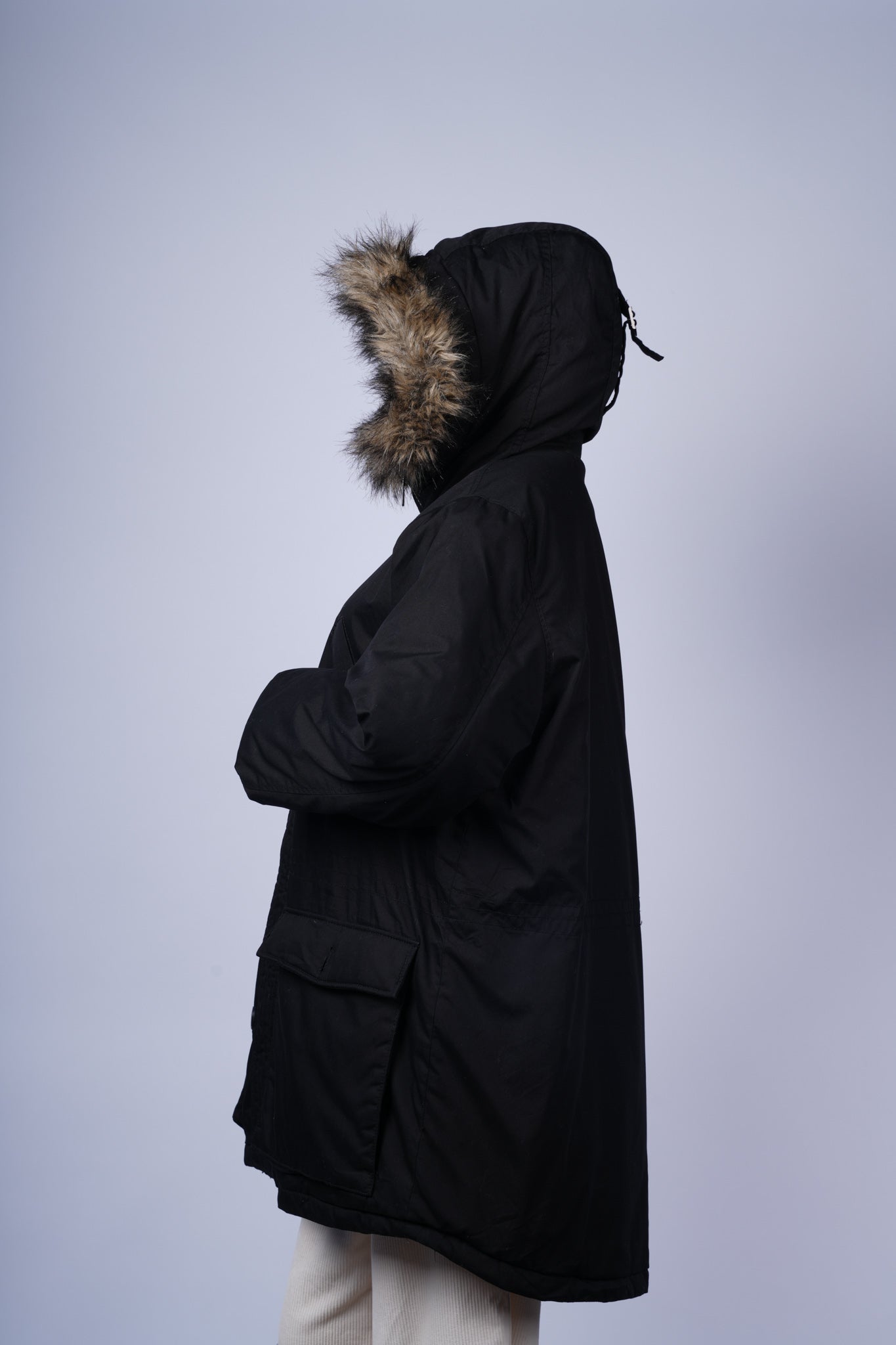 Stylish winter parka featuring cozy faux fur hood and functional pockets.