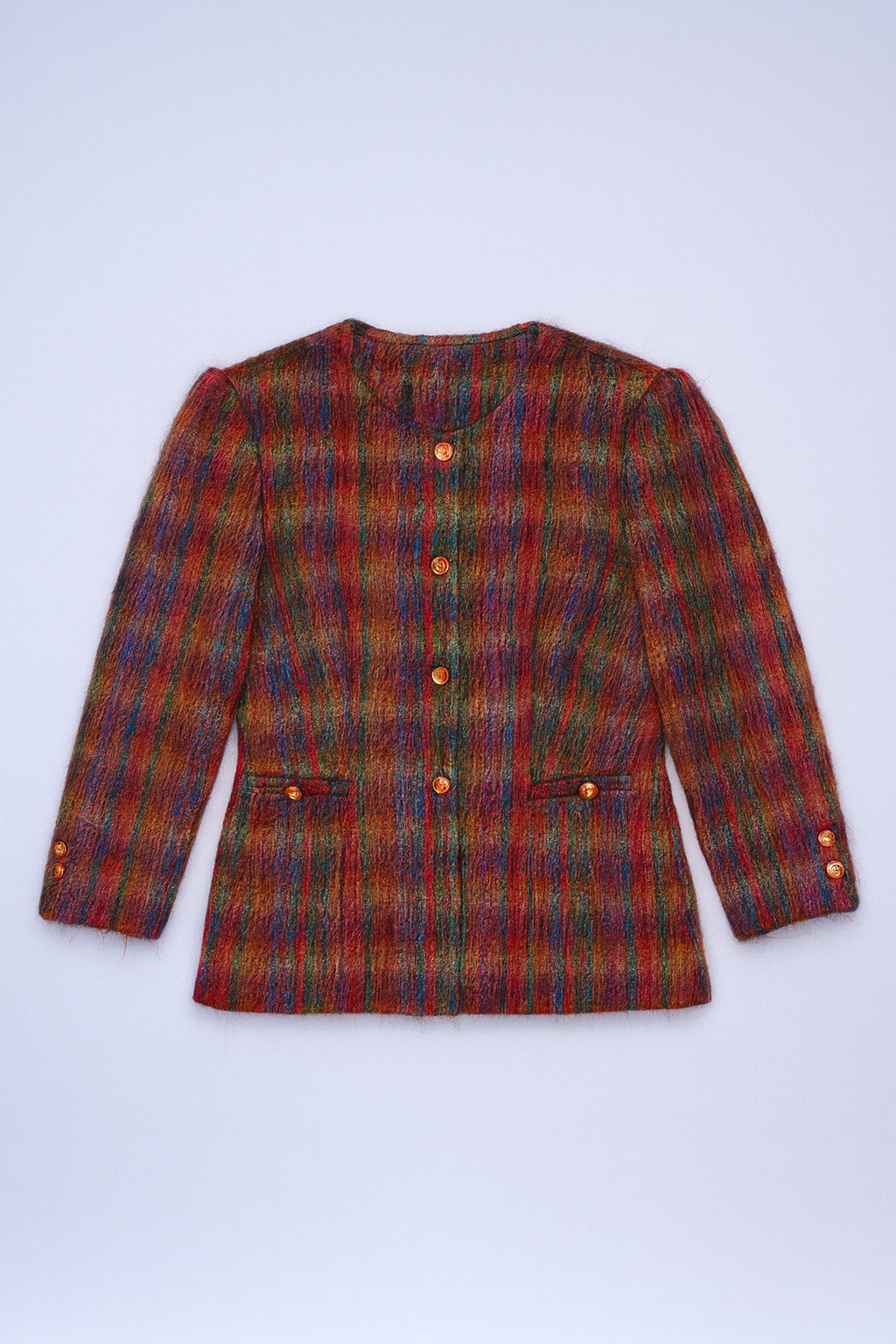Colorful plaid wool-blend coat with front button closure and welt pockets.