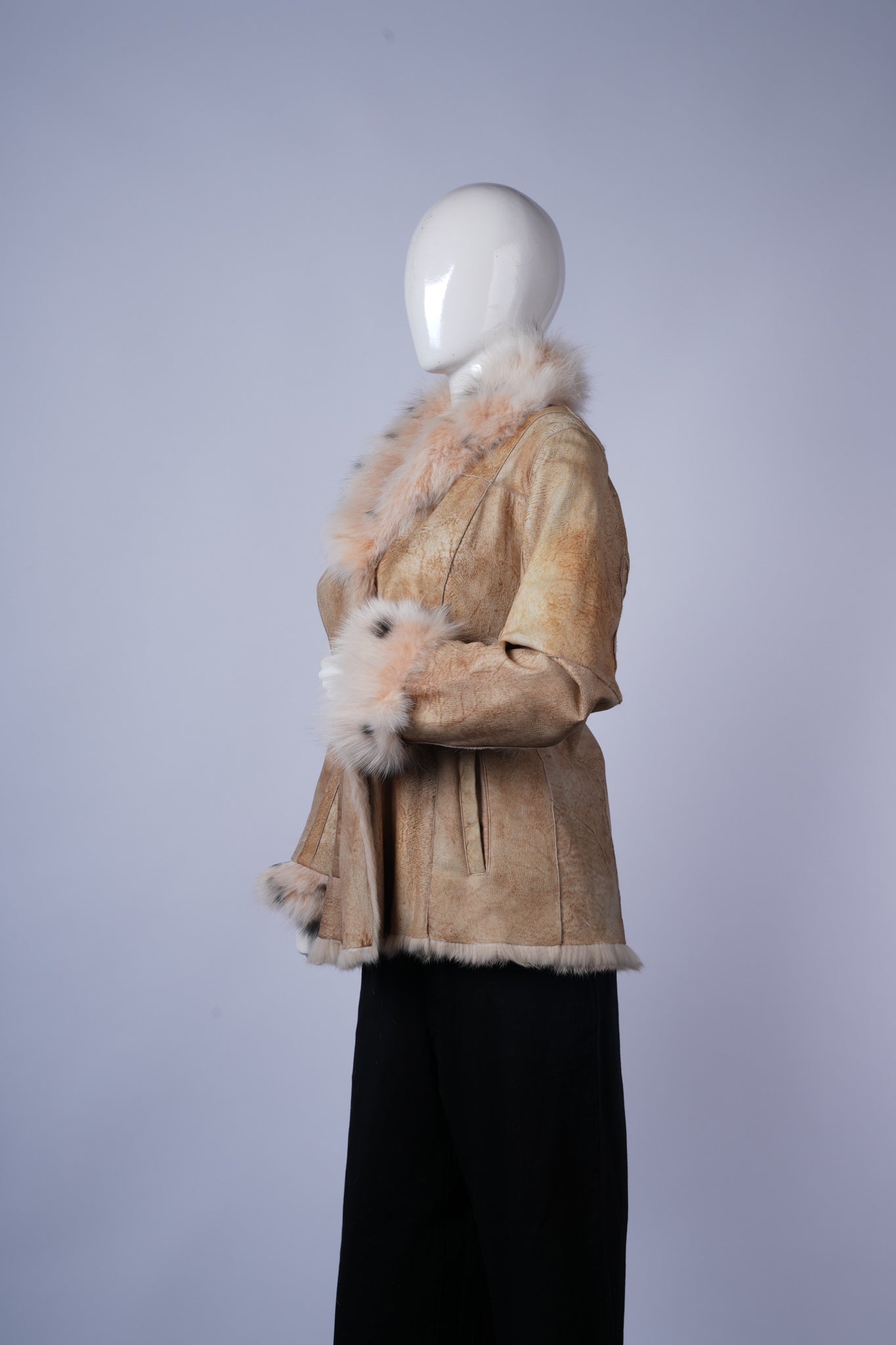 Elegant suede jacket featuring plush fur trim and classic button-front design