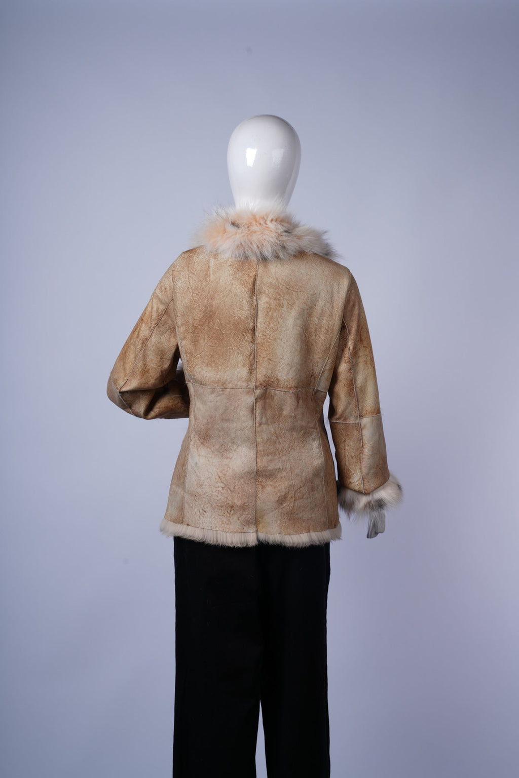 Warm beige vintage-style jacket perfect for casual or chic cold-weather outfits.
