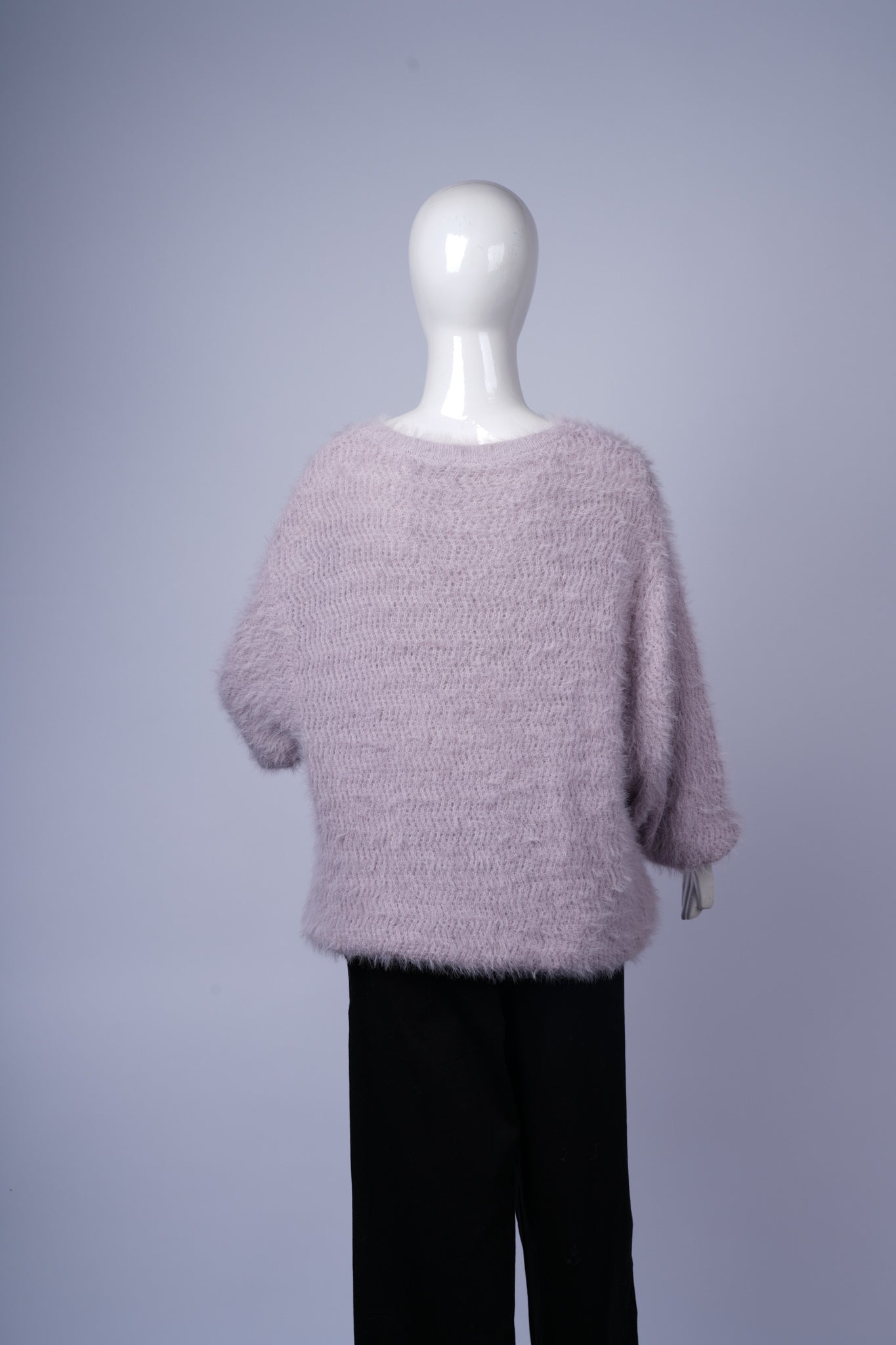 Shaggy textured light purple sweater for warm and stylish everyday wear.