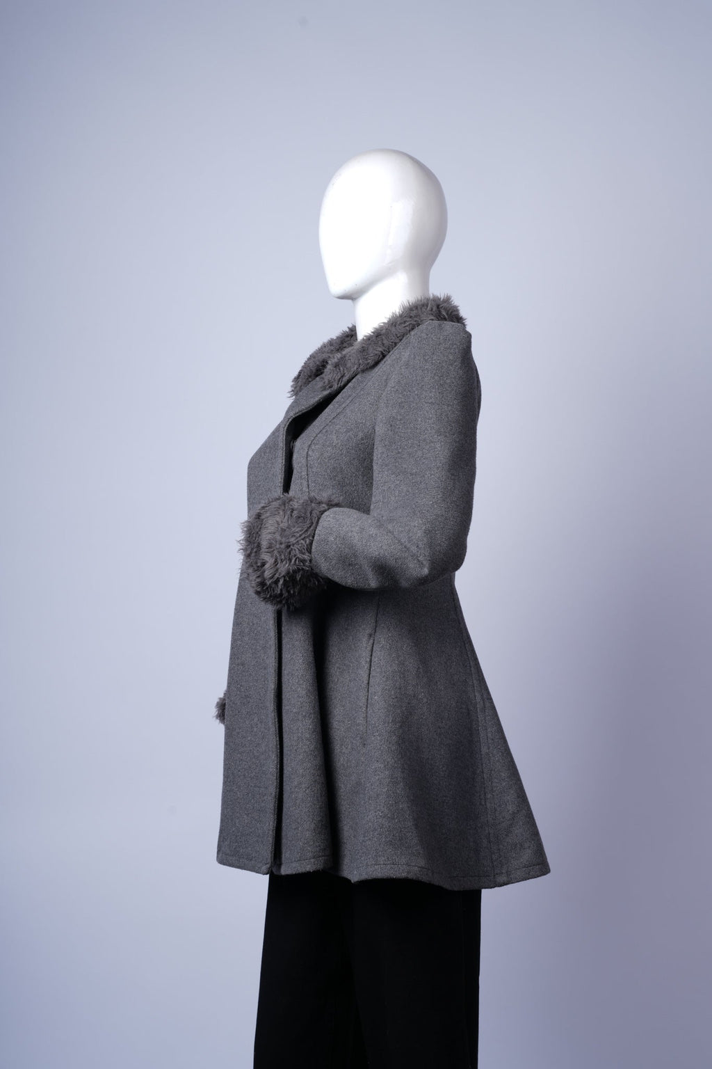 Chic grey coat with structured silhouette, perfect for layered cold-weather outfits.
