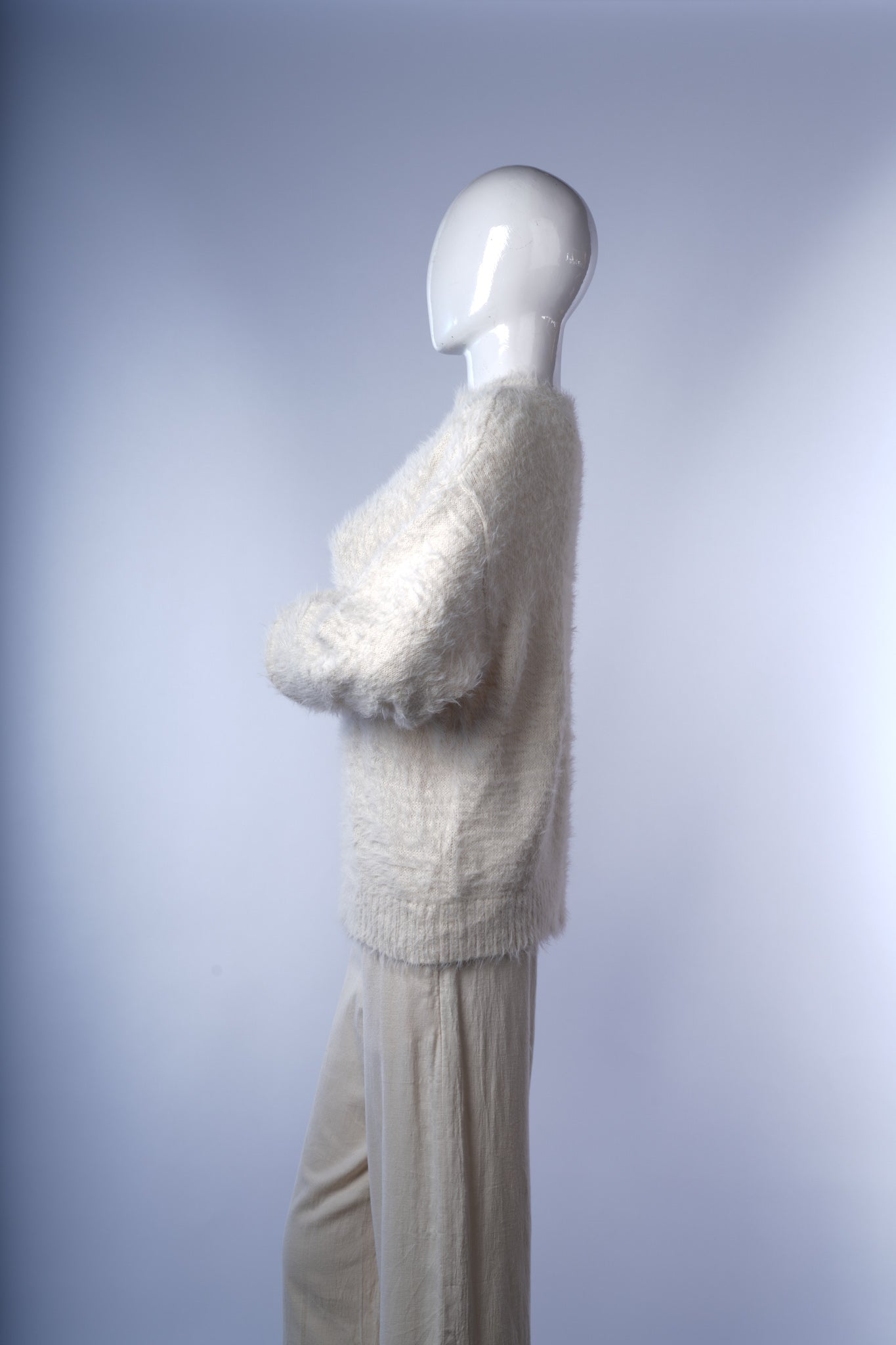 Stylish women's white faux fur knit sweater with vintage-inspired elegance.