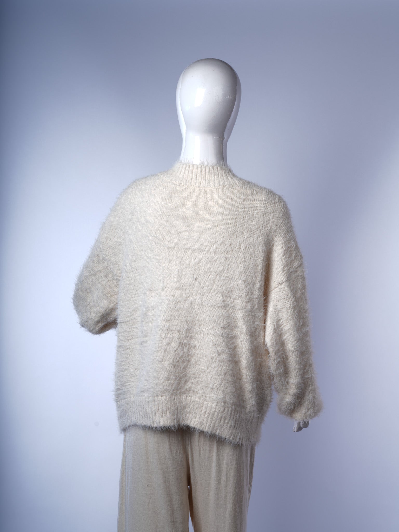 Versatile fluffy white sweater for women, perfect for chic winter layering.