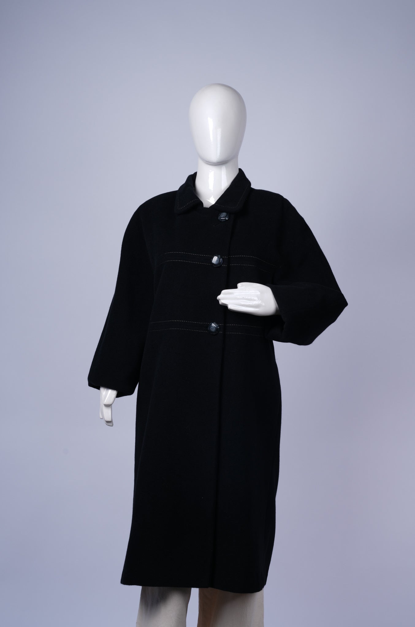 women's elegant longline coat ideal for formal or smart-casual layering.