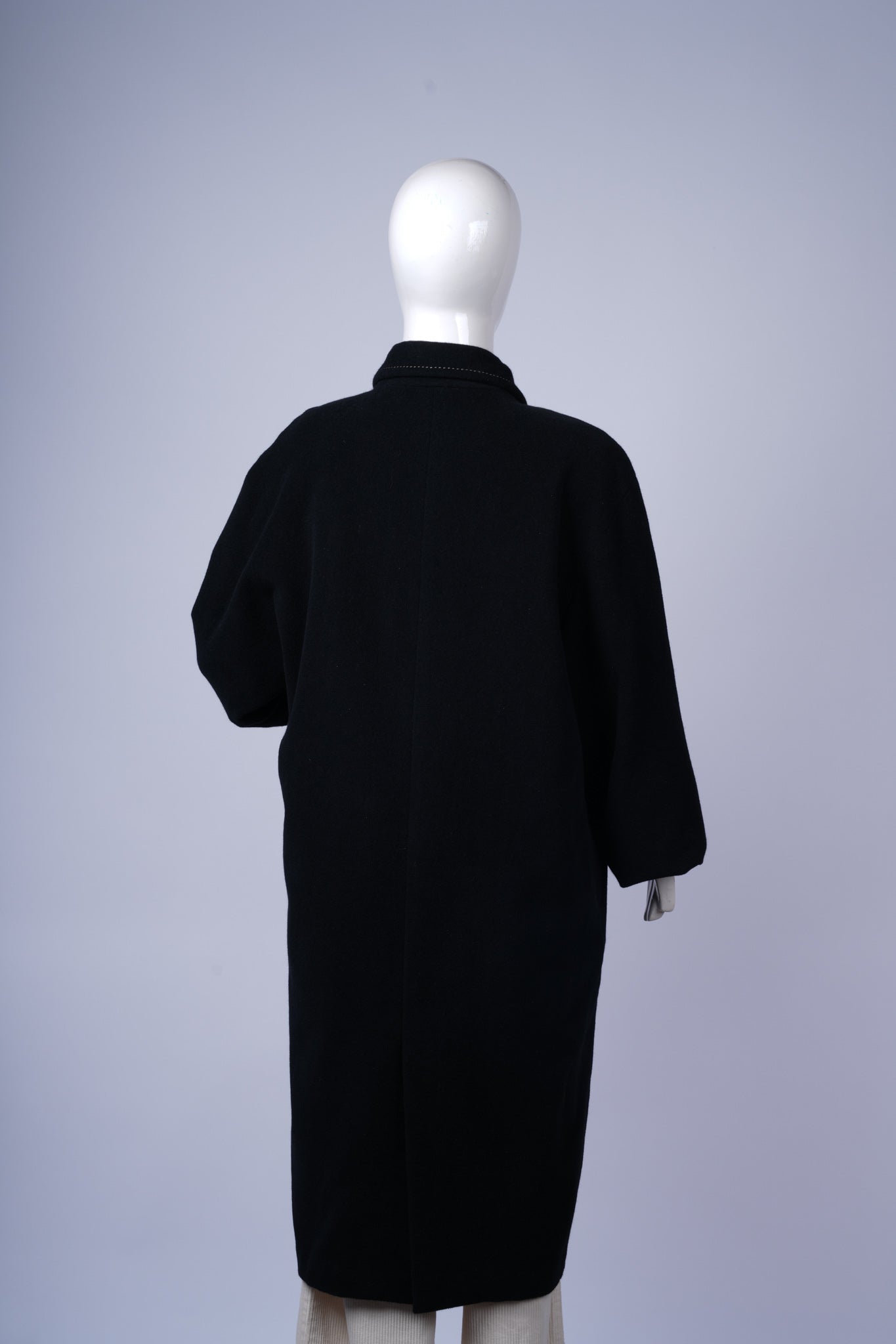 Sophisticated wool-blend coat perfect for office or evening wear.