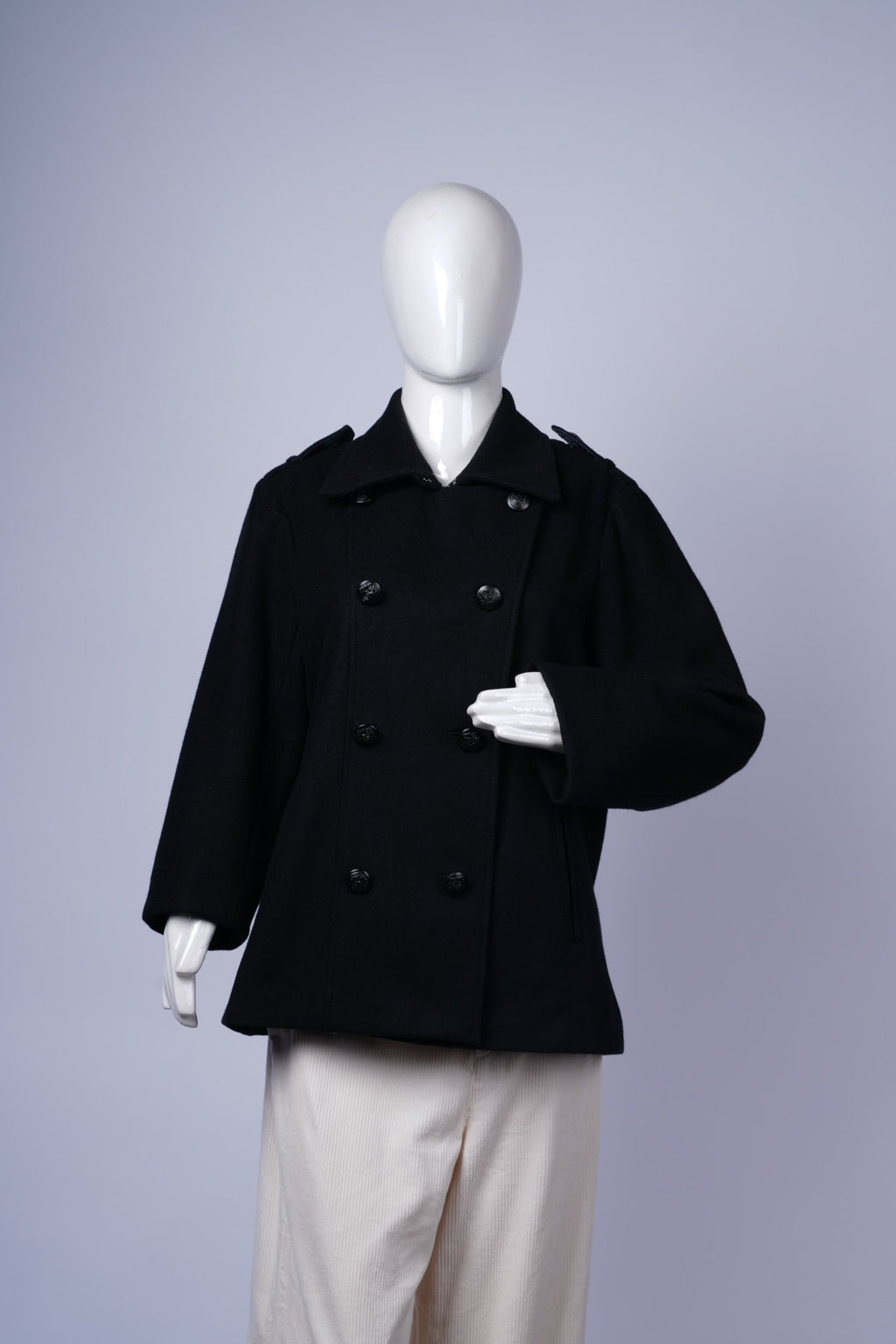 Classic tailored black peacoat for men, ideal for cold-weather layering.