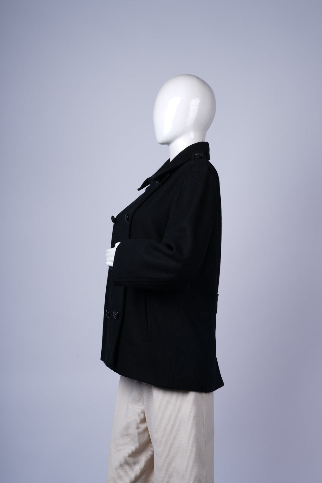 Stylish double-breasted wool coat with structured fit and versatile design.