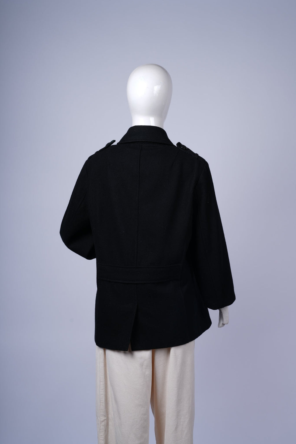 Elegant men?s winter coat featuring wide lapels and timeless peacoat silhouette.