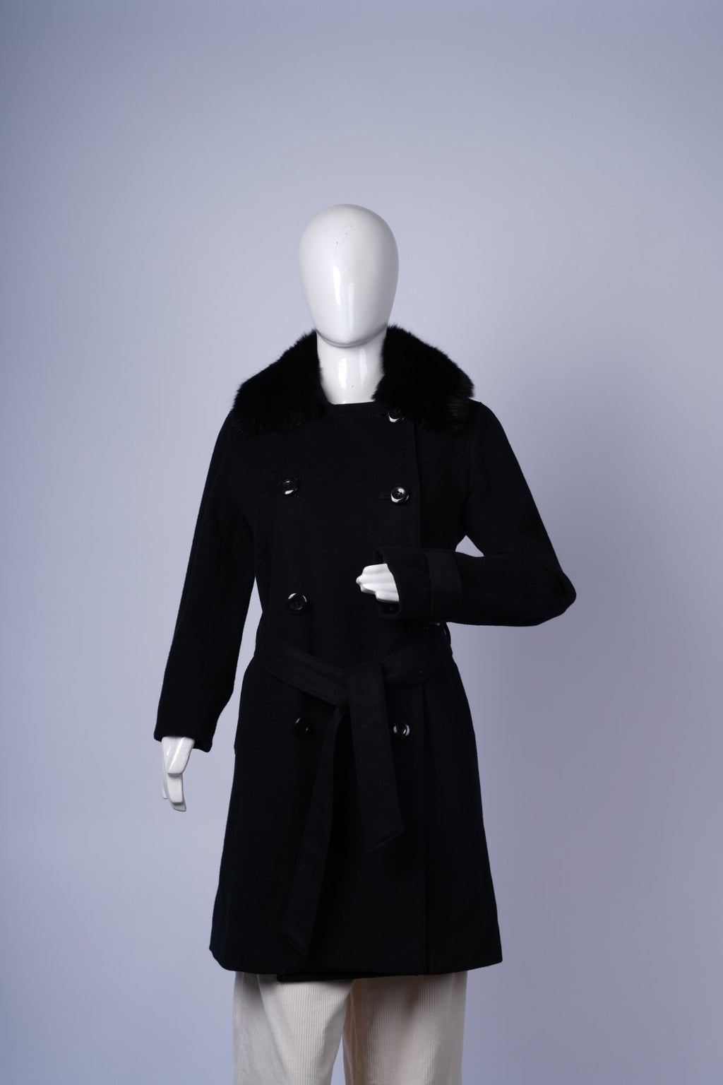 women's elegant winter coat combining warmth with structured tailoring.