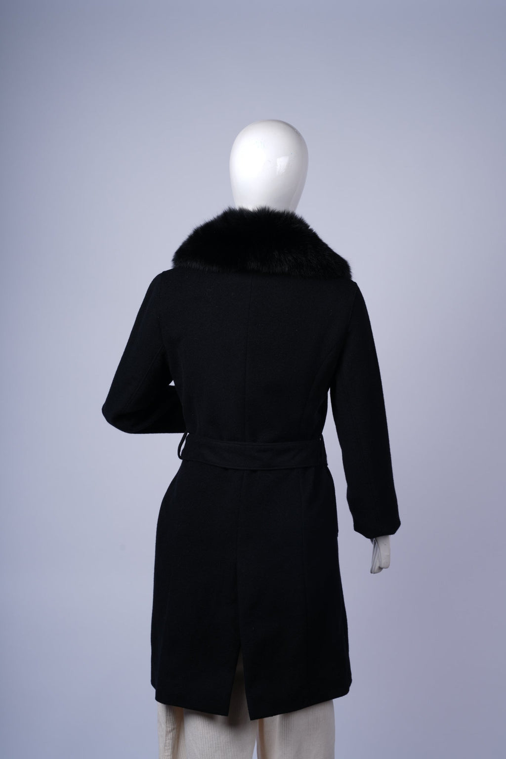 Stylish black coat perfect for formal or smart-casual winter outfits.
