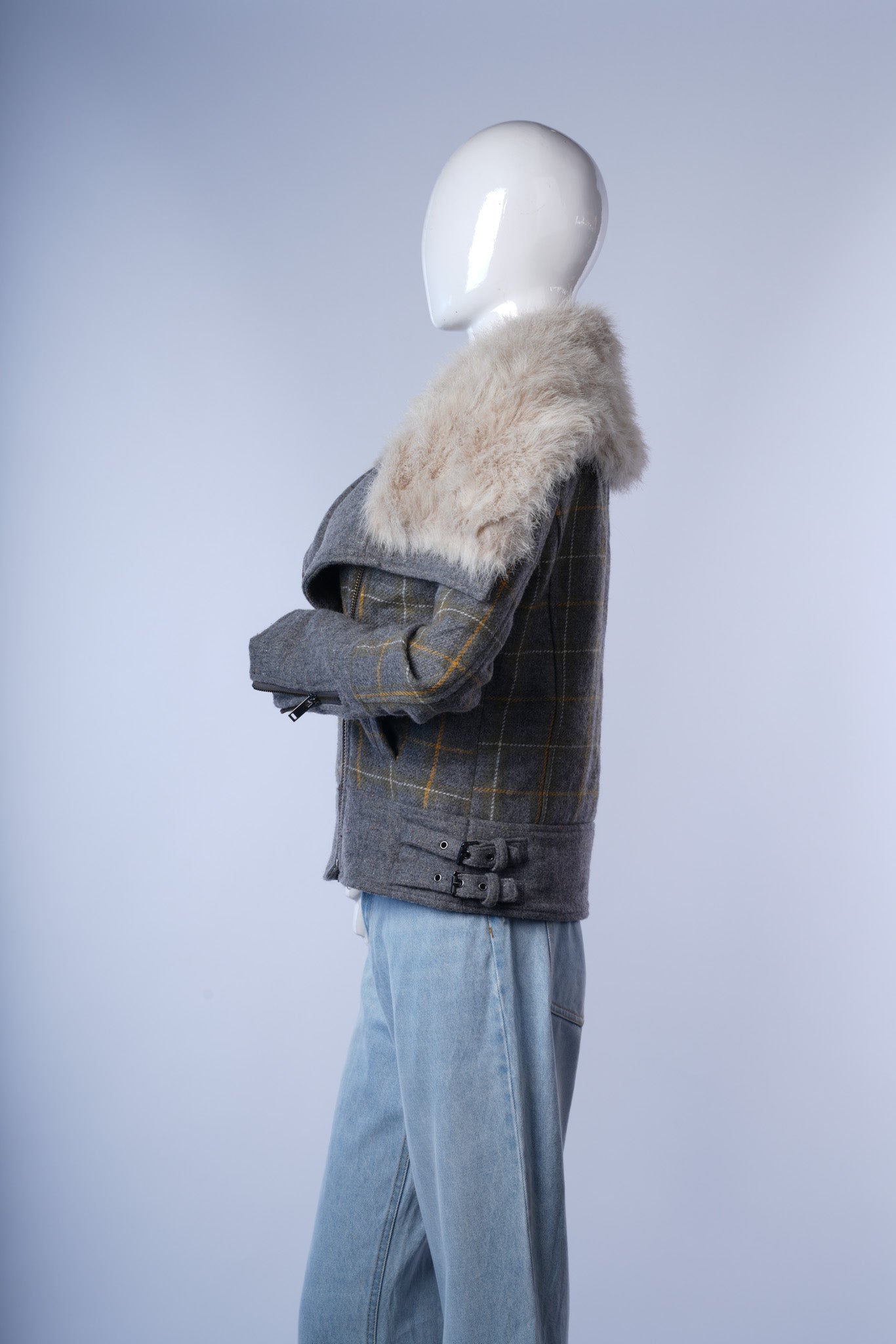 Stylish plaid coat with front zipper and soft fur collar, ideal for cool-weather layering.