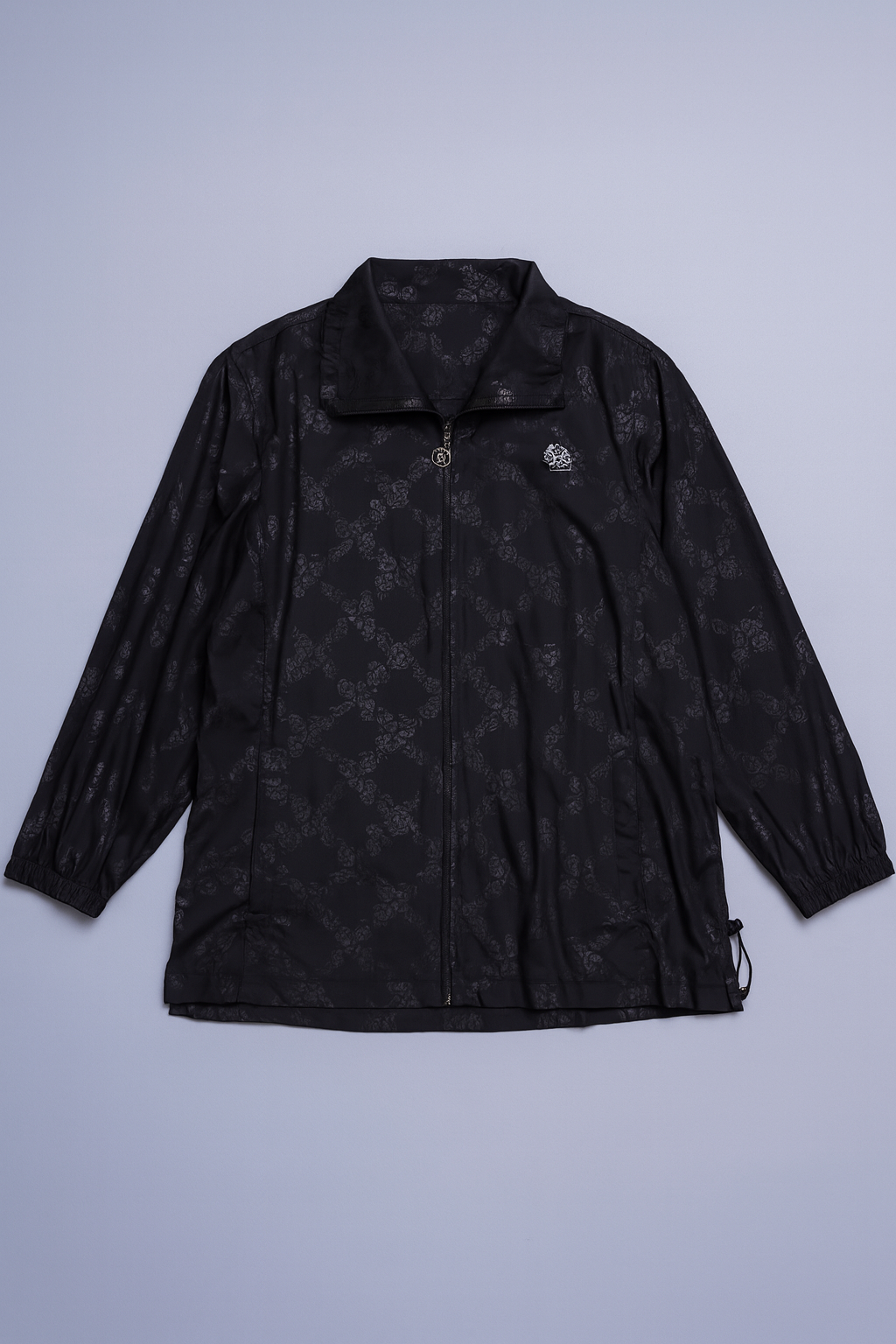 Lightweight women's jacket with all-over pattern and full-zip front.