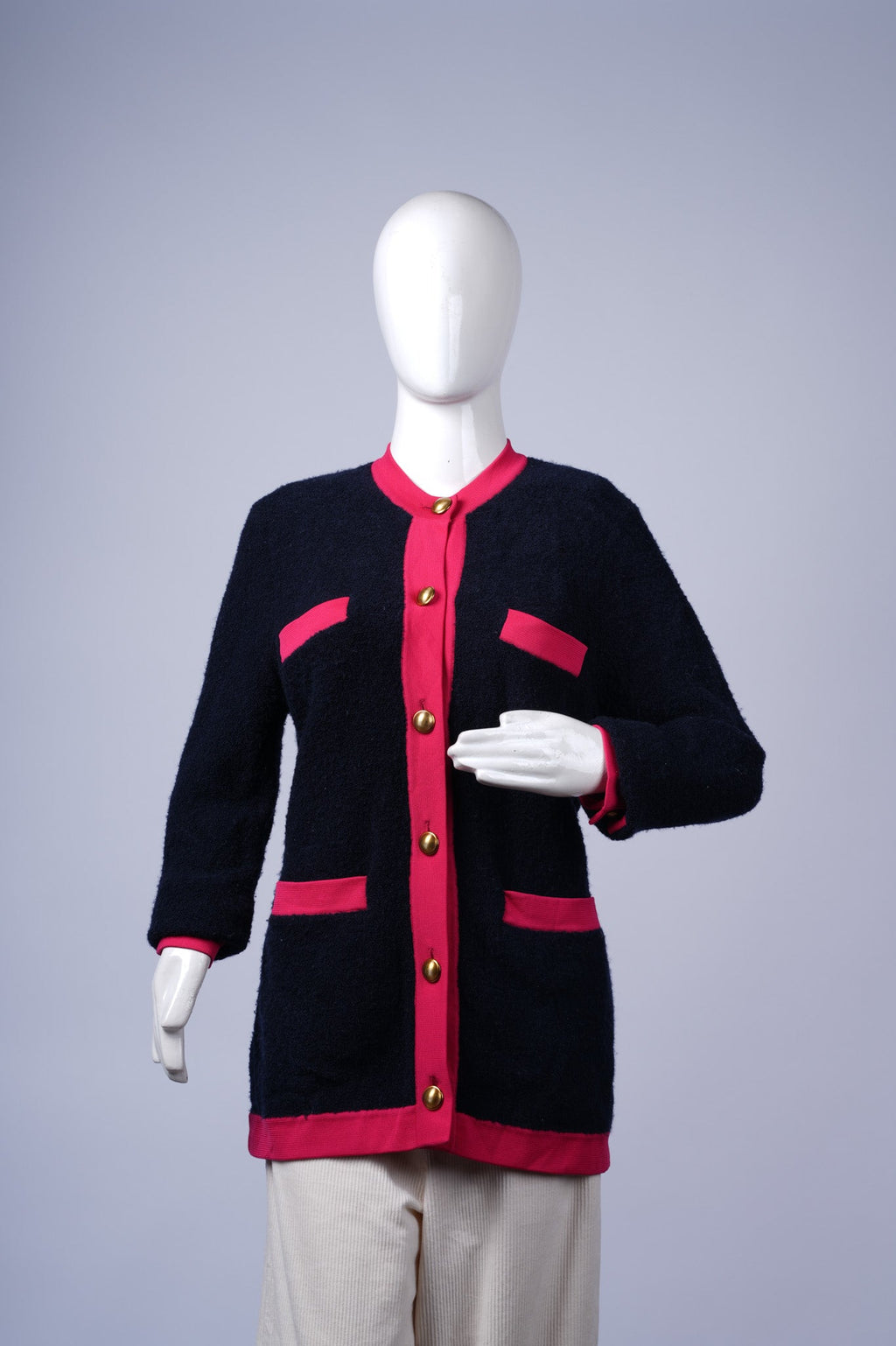 women's cozy cardigan featuring vibrant accents and structured front details.