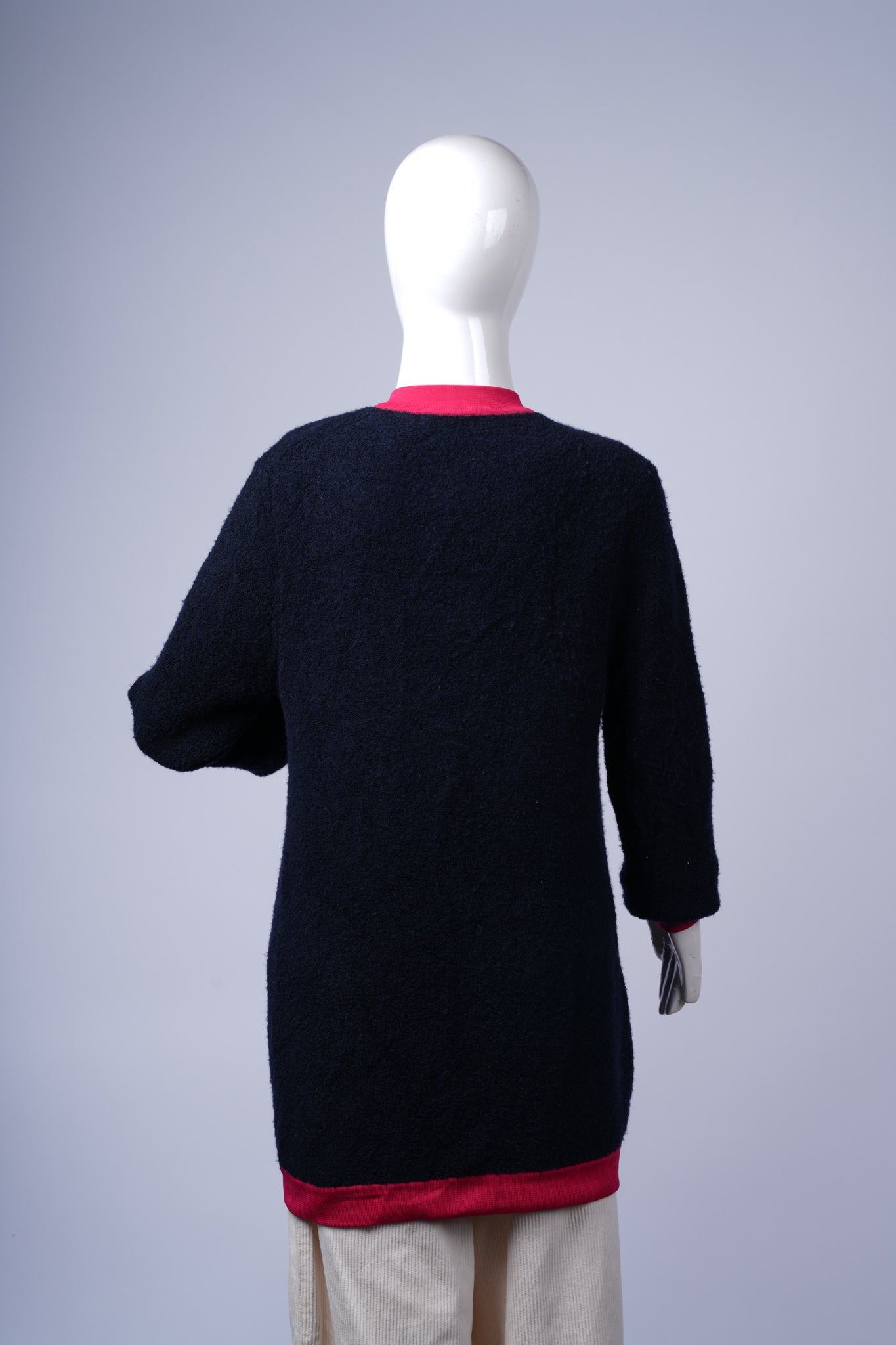 Elegant patch-pocket cardigan perfect for layering over casual or polished outfits.