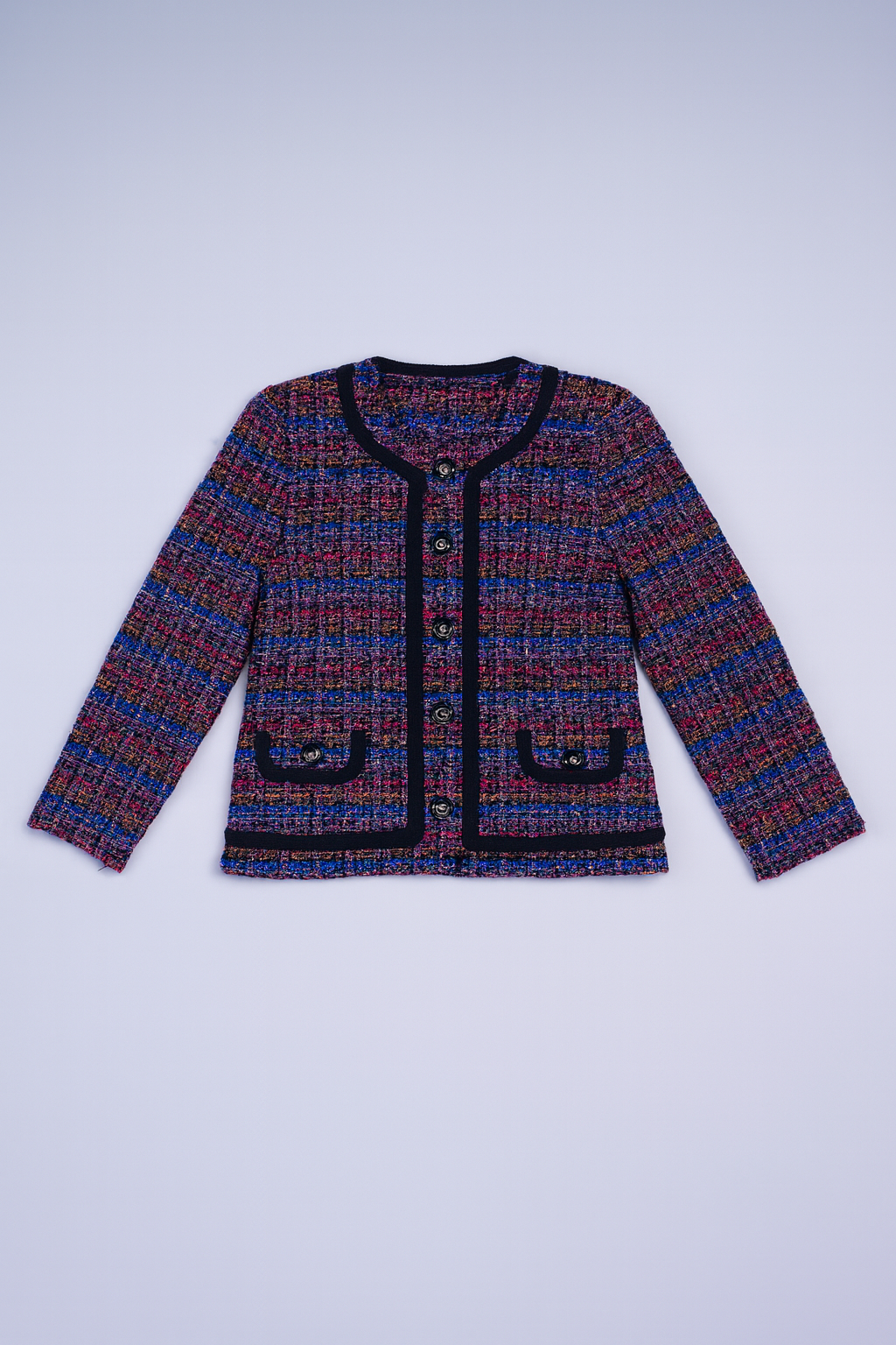 Structured multicolor tweed coat with decorative buttons and contrasting trims.