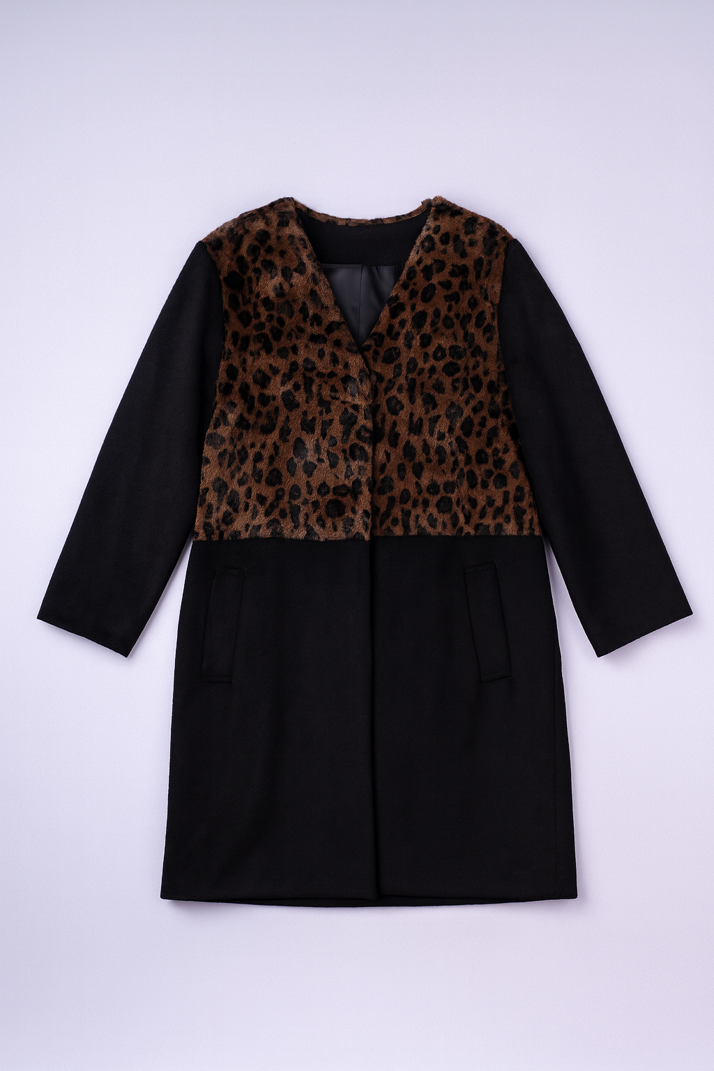 Mid-length coat featuring bold leopard print with solid black lower panel.