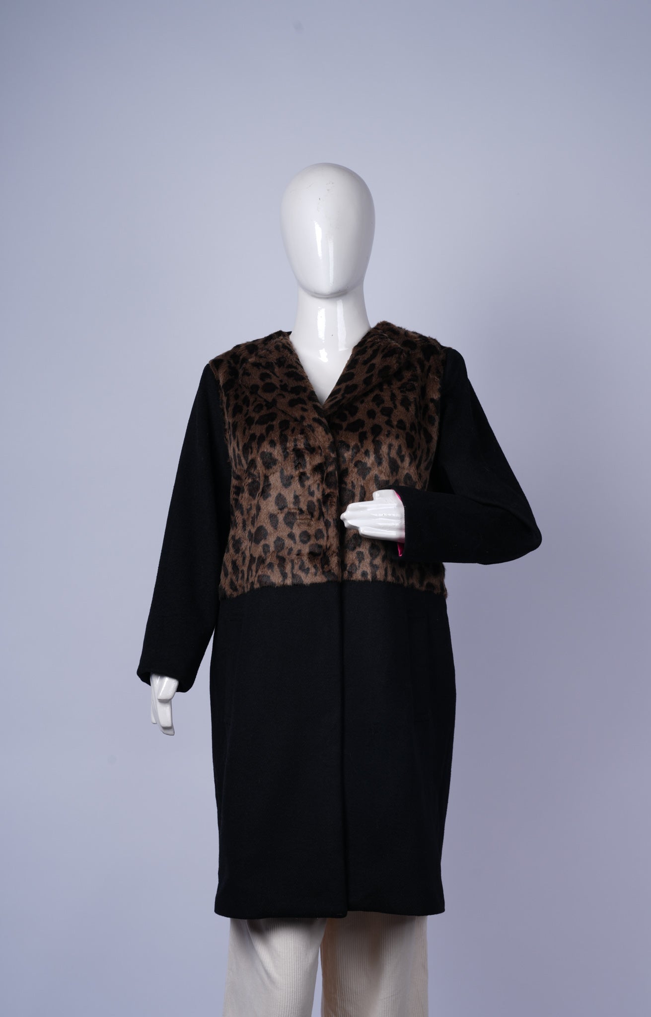 women's wool-blend coat combining striking animal print and classic black fabric.