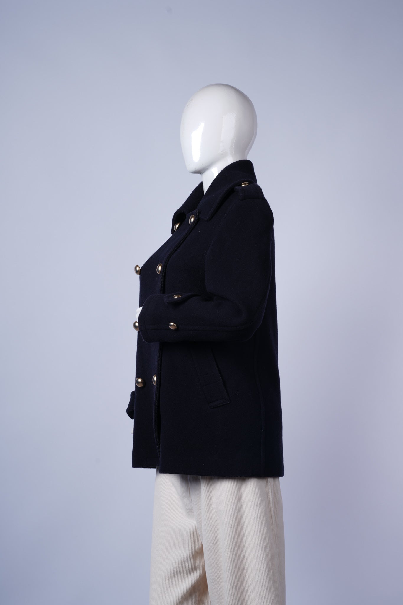 Classic double-breasted pea coat in deep blue with functional pockets.