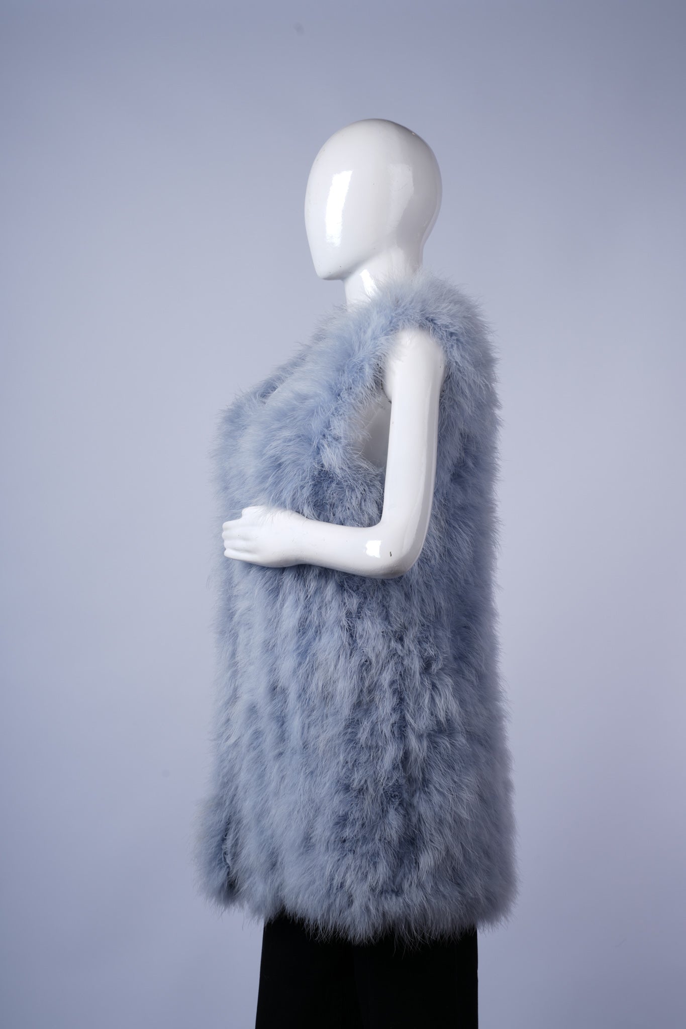 Soft textured faux-fur vest in light gray, perfect for layering over tops or sweaters.