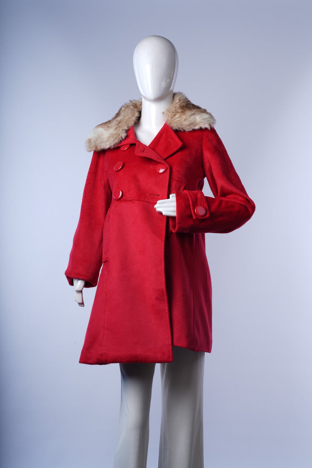 Elegant crimson overcoat featuring wide faux fur trim and classic structured silhouette.