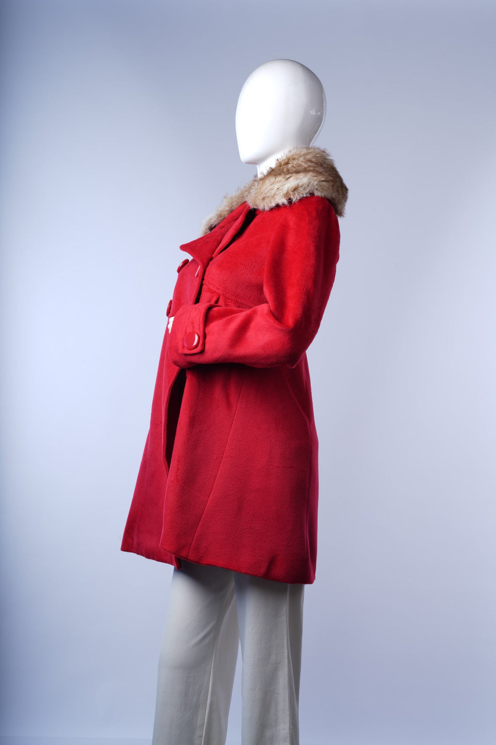 women's red winter coat with luxurious cream fur collar and side pockets.
