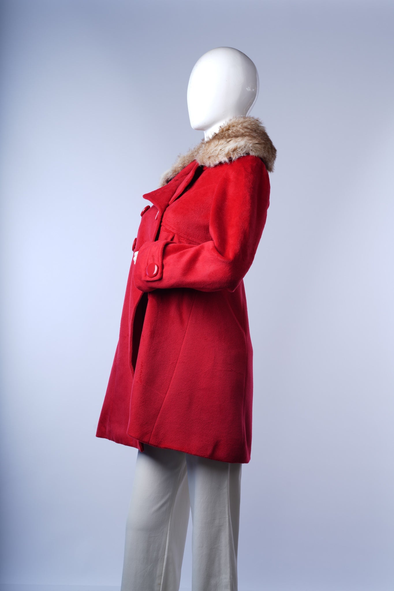 women's red winter coat with luxurious cream fur collar and side pockets.