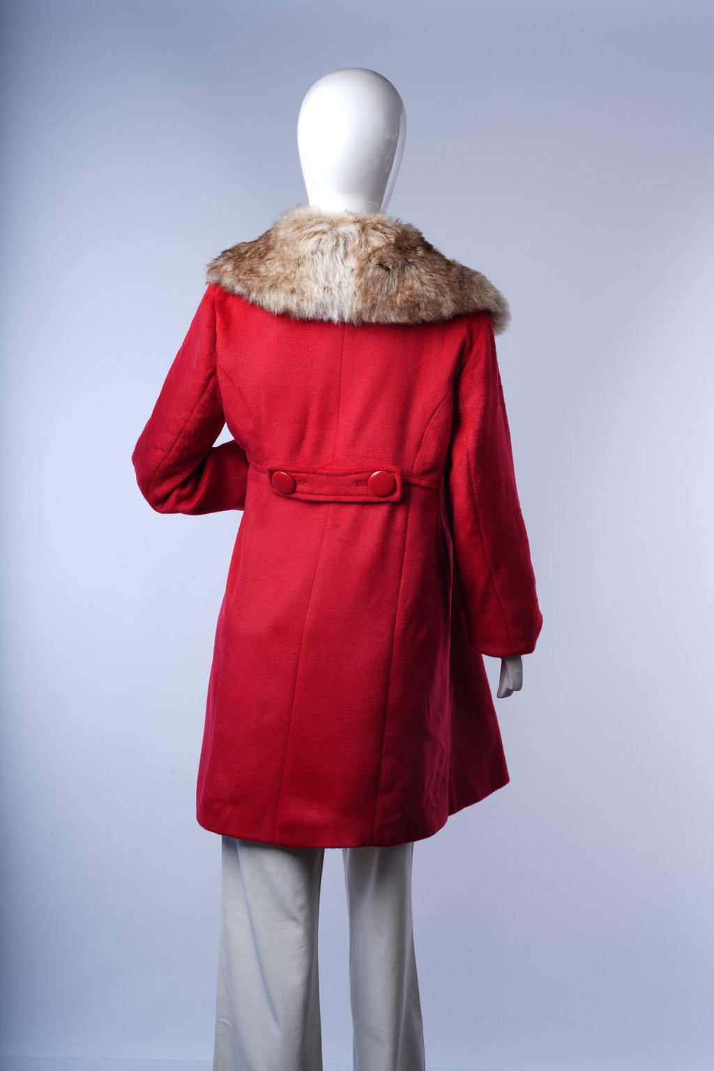 Chic wool-blend coat offering warmth, sophistication, and bold color contrast.