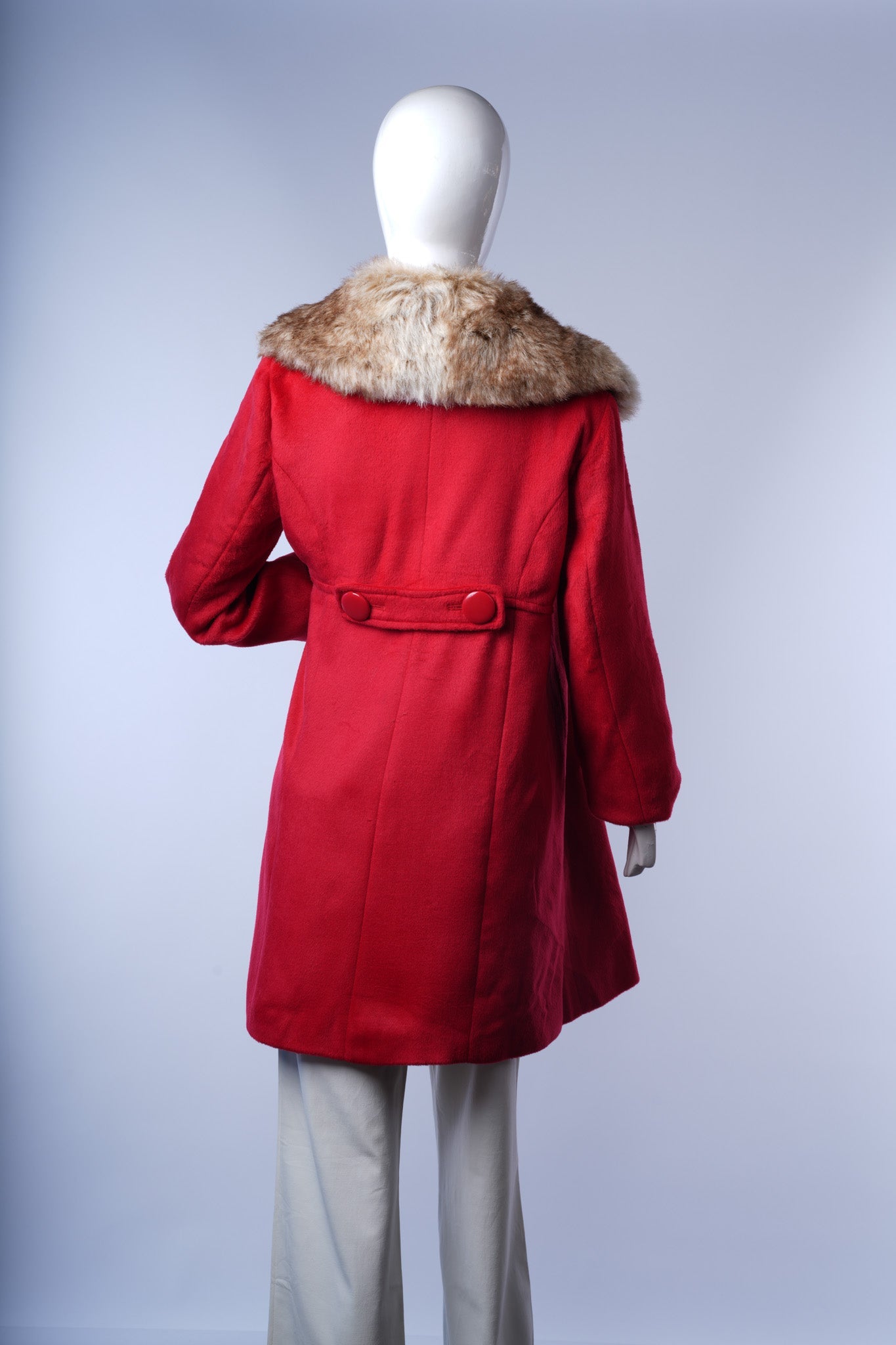 Chic wool-blend coat offering warmth, sophistication, and bold color contrast.