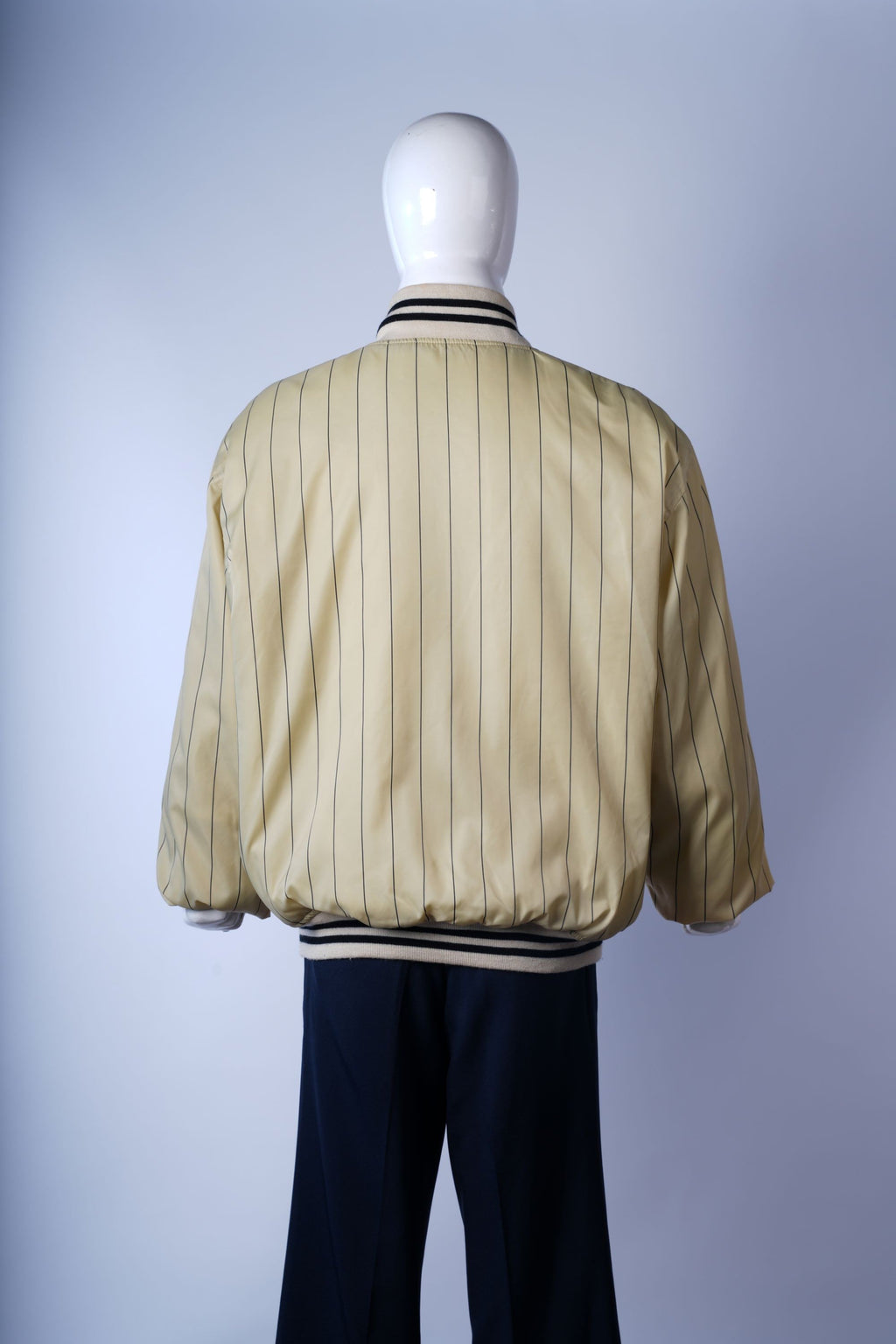 Classic cream varsity jacket, perfect for retro fashion or collectible outerwear.