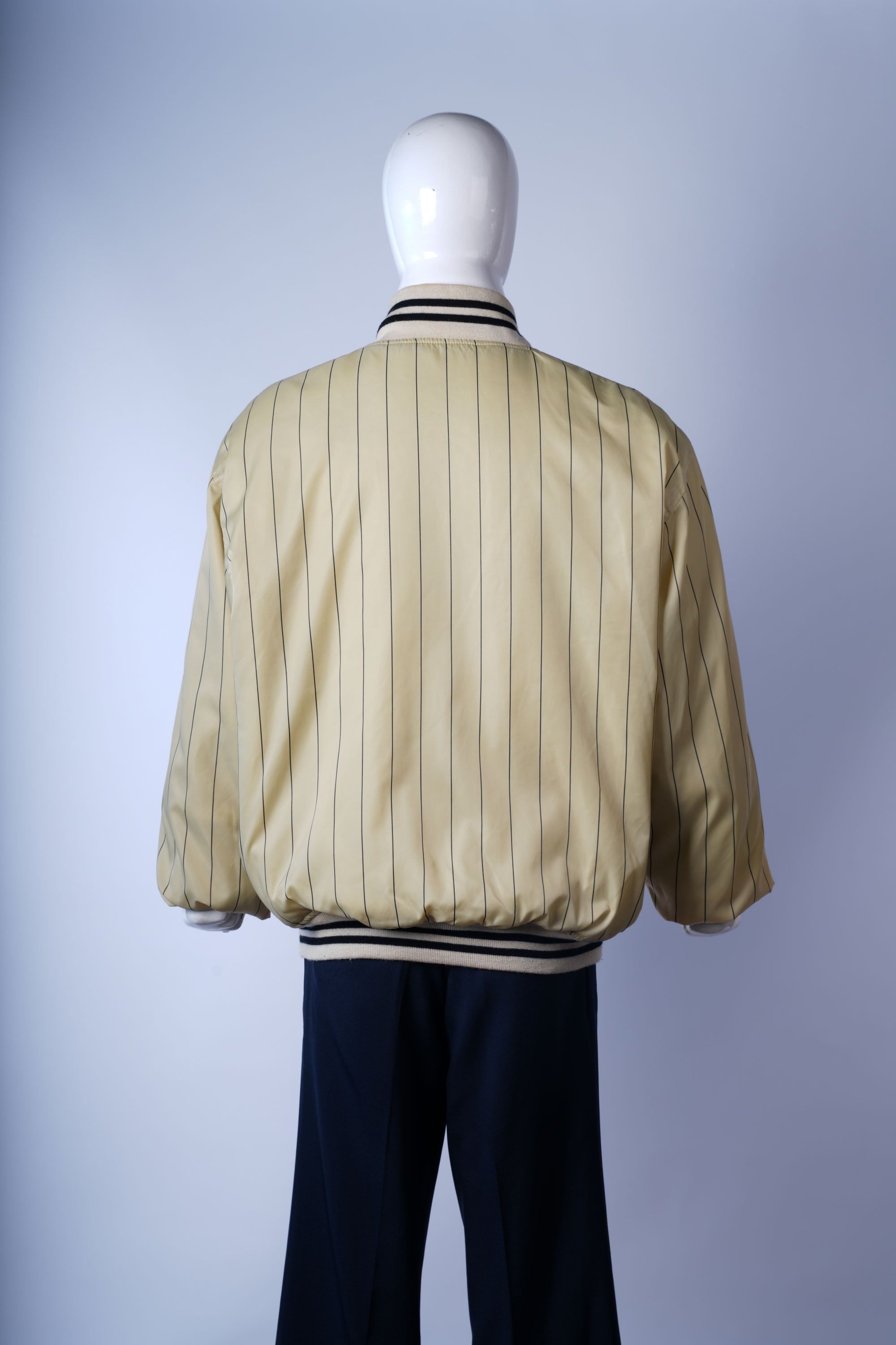 Classic cream varsity jacket, perfect for retro fashion or collectible outerwear.