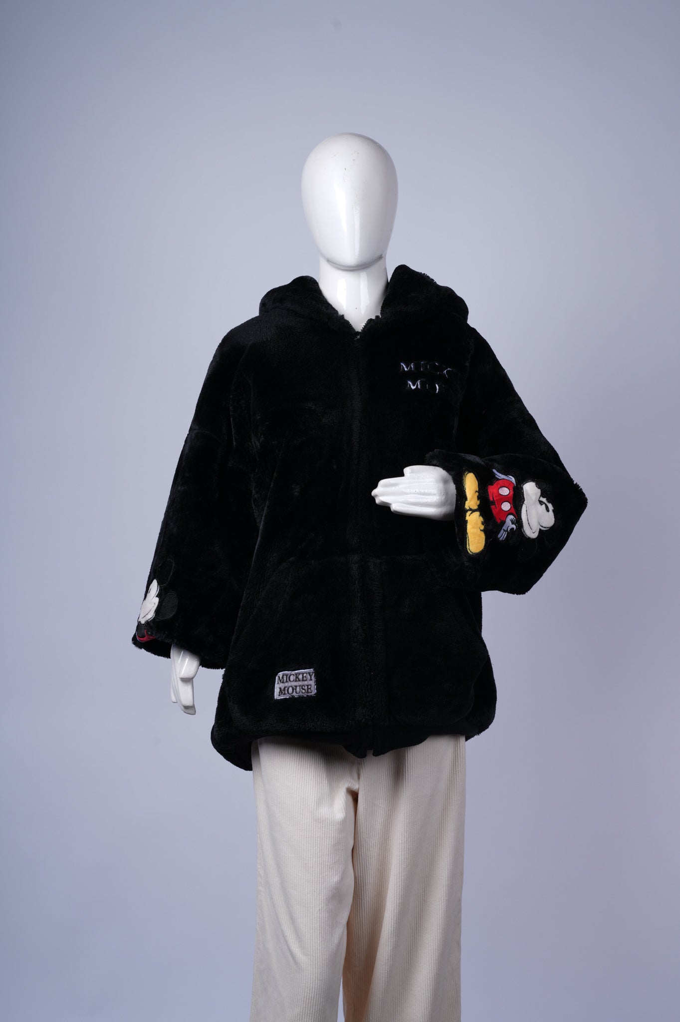 women's cozy winter jacket combining playful Disney detail with soft faux fur.