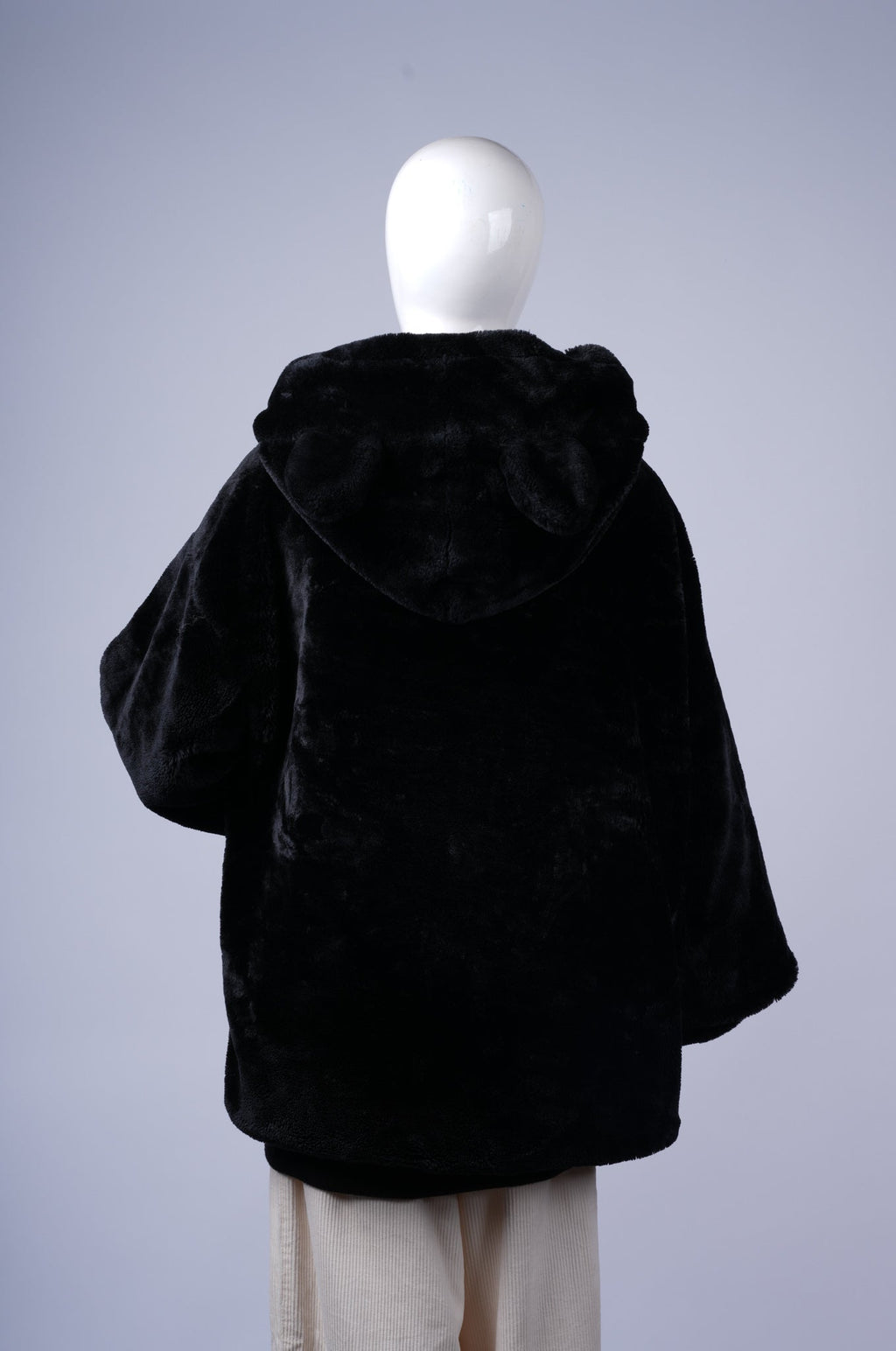 Warm zip-up jacket perfect for layering on chilly days with a whimsical touch.