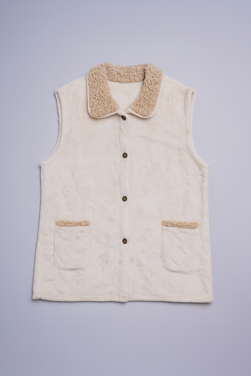 sherpa fleece vest with button-front closure and cozy inner lining.