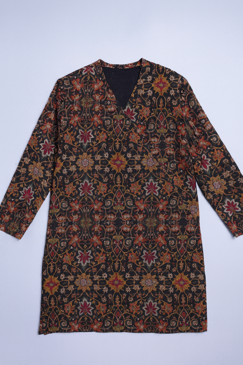 Dark long-sleeve kaftan featuring intricate floral and botanical patterns.
