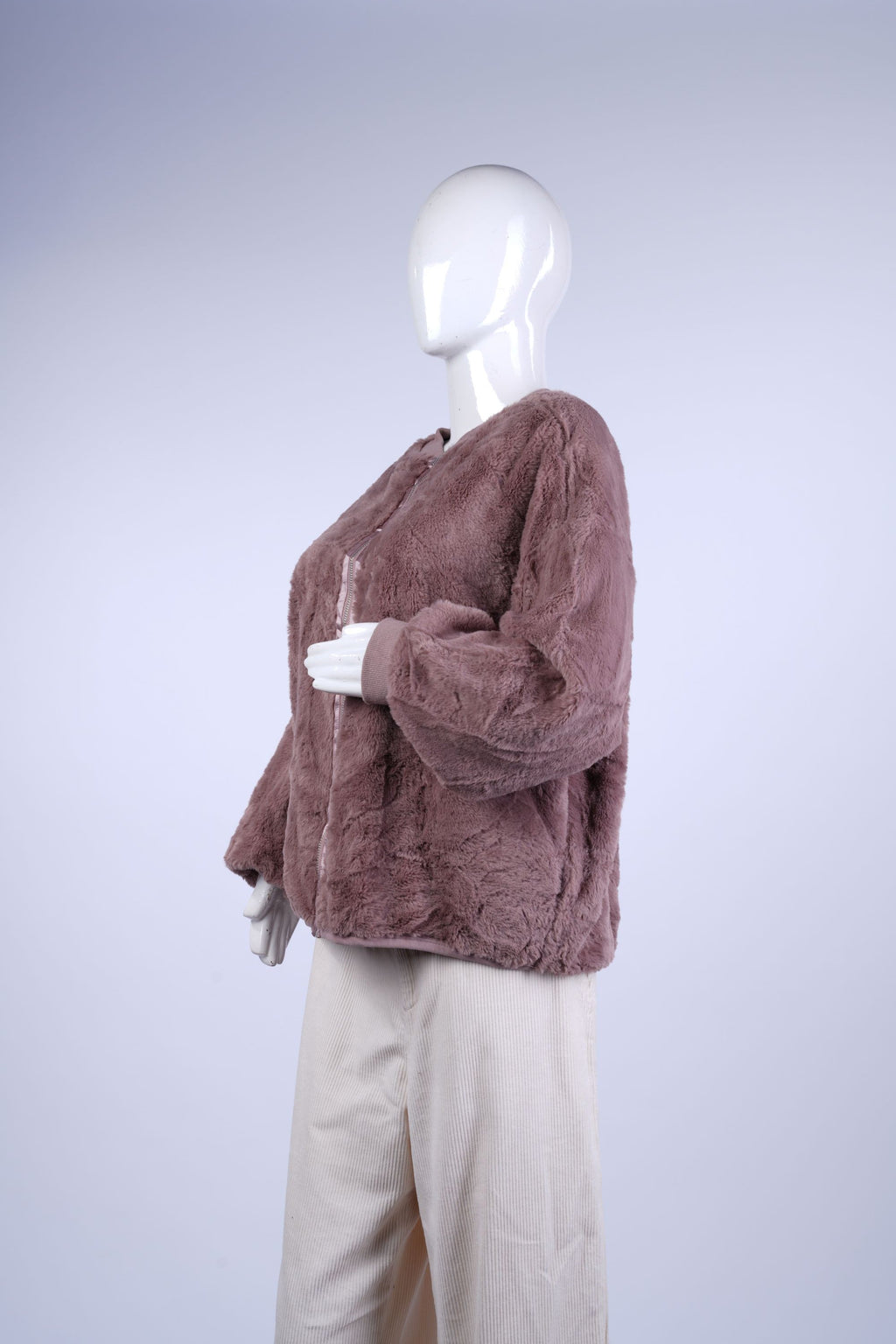Soft textured faux-fur outerwear perfect for layering in cooler weather.