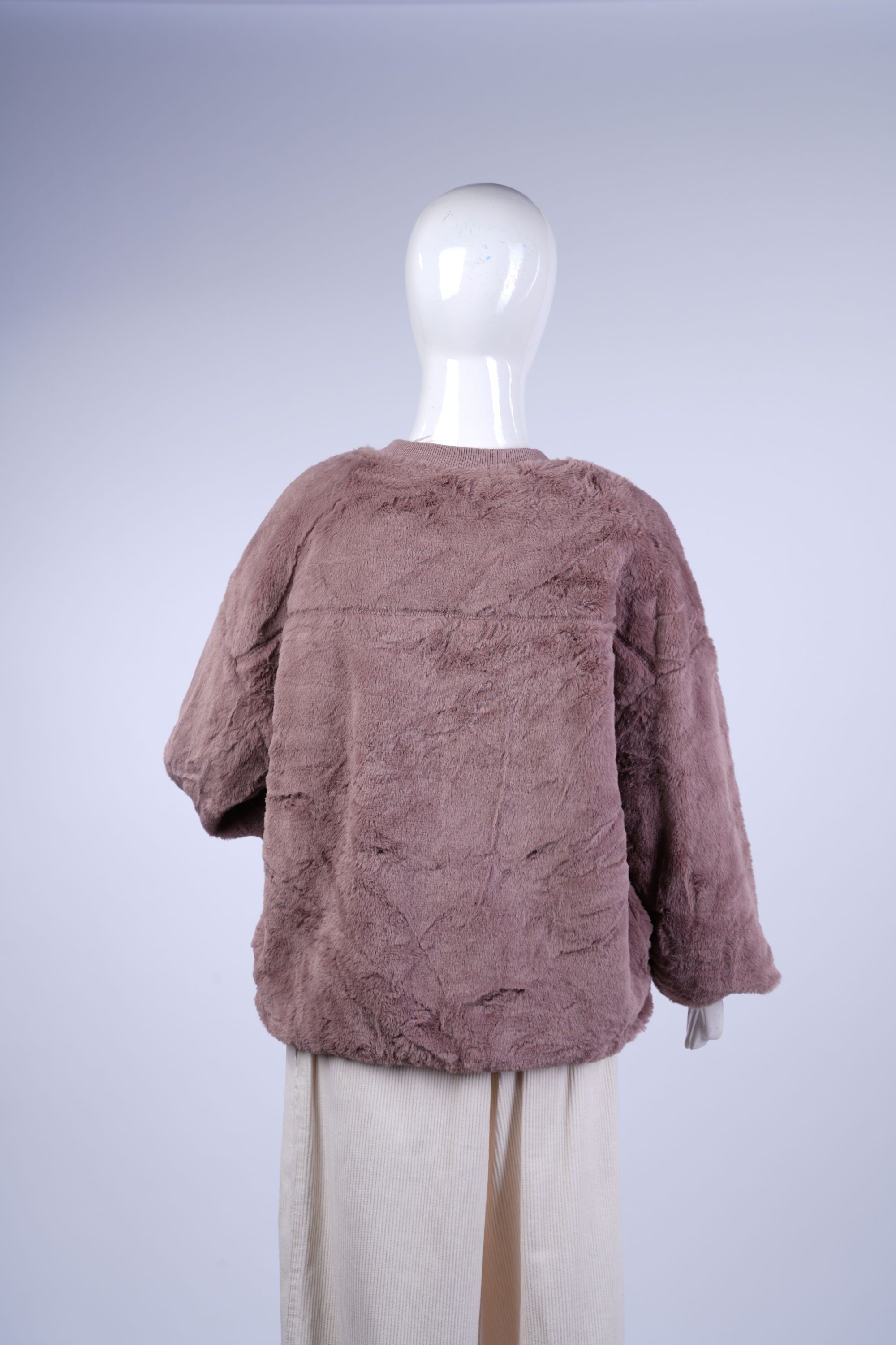 Chic warm jacket combining plush fabric with practical zip and structured fit.