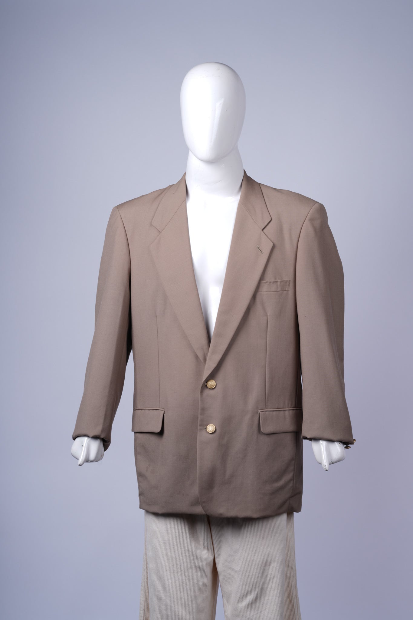 Elegant beige blazer for women, ideal for formal or smart-casual outfits.
