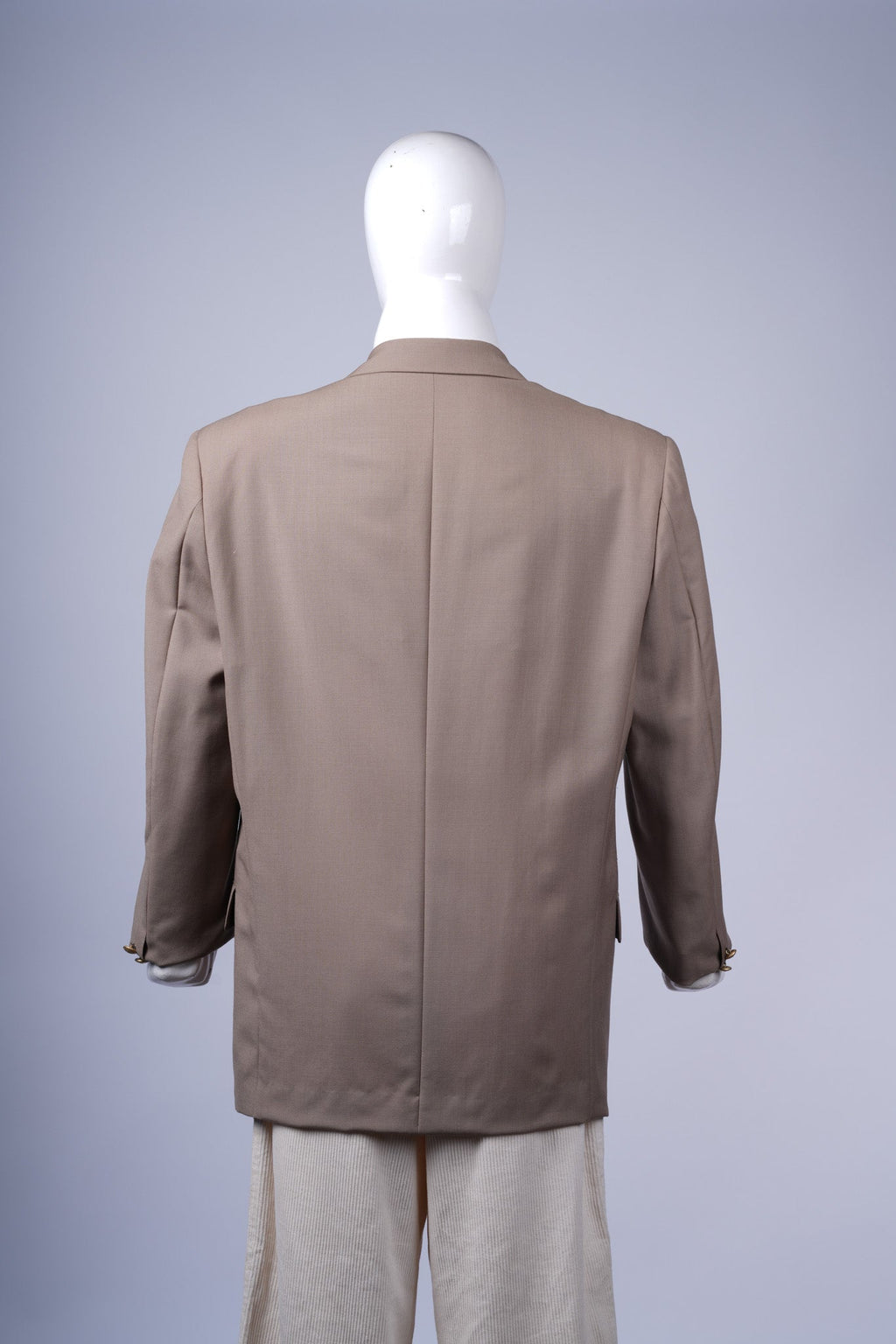 Stylish single-breasted beige blazer for women, perfect for work or evening wear.