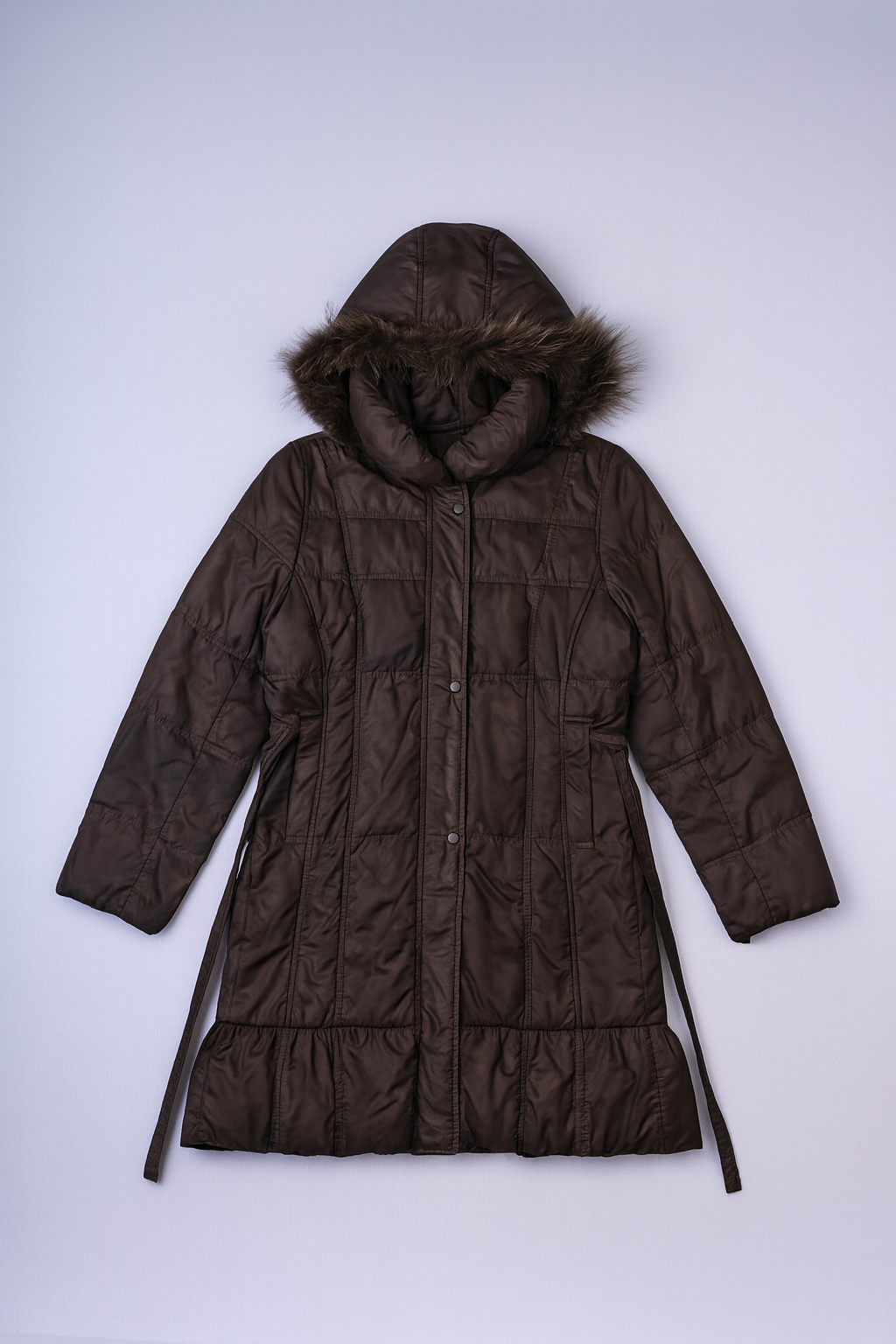 women's long quilted puffer jacket with fur-trimmed hood and belted waist.