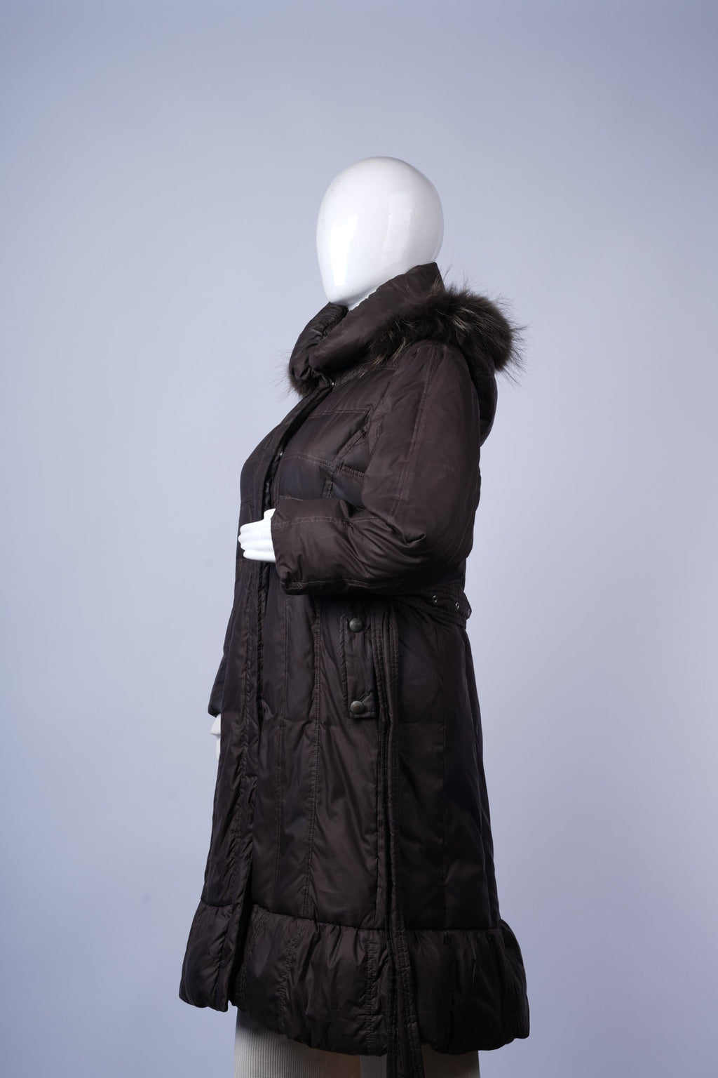 Stylish long winter jacket for women with fur hood and flattering silhouette.