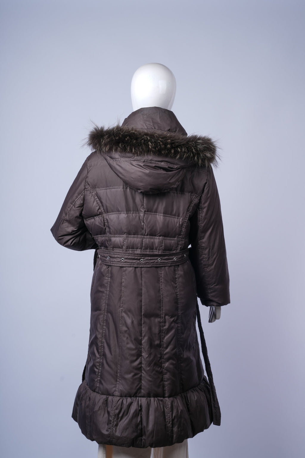 Warm quilted women's coat perfect for cold-weather layering with belt detail.