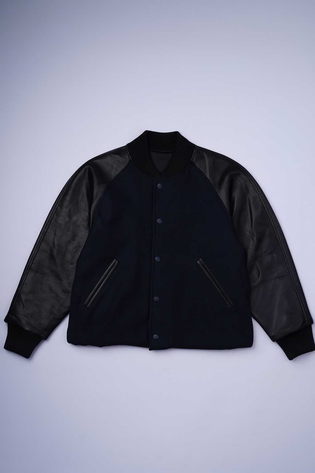 Classic varsity jacket with wool-blend body and faux leather sleeves for a sporty look.