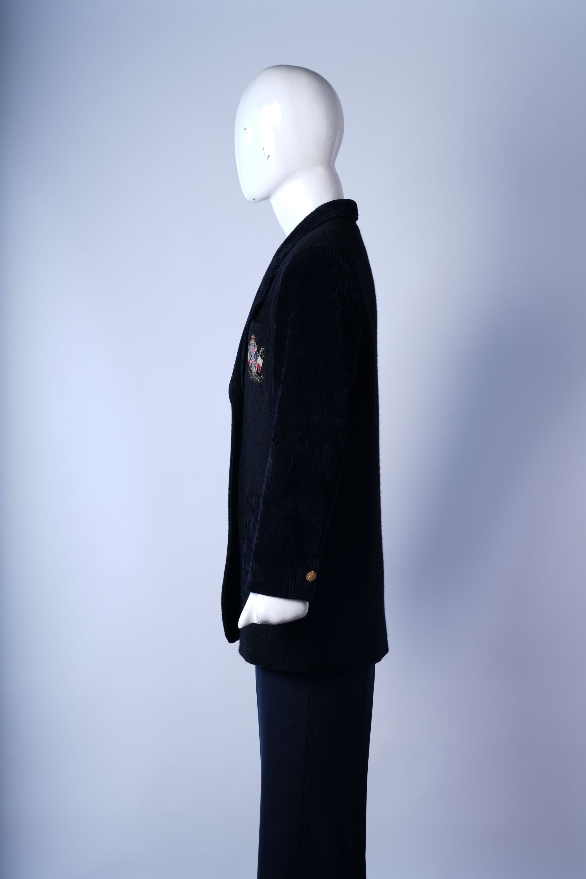 Back detail of wool Chester overcoat with seam and hem finish