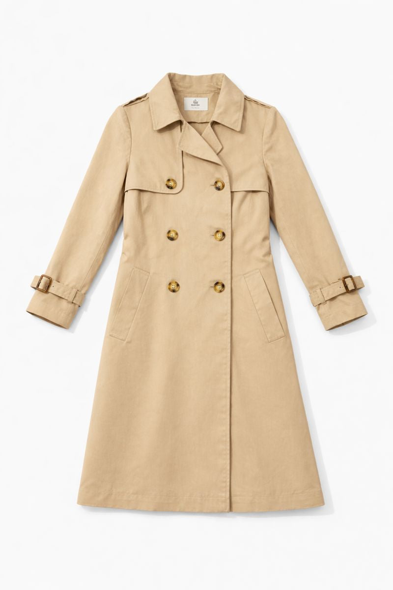Classic beige double-breasted trench coat with wide lapels, shoulder epaulettes, adjustable cuff tabs, and welt pockets