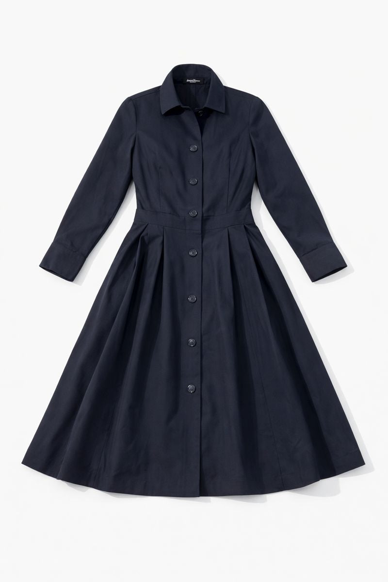 Dark panelled shirt dress with long sleeves, classic collar, button-front closure, and pleated A-line midi skirt